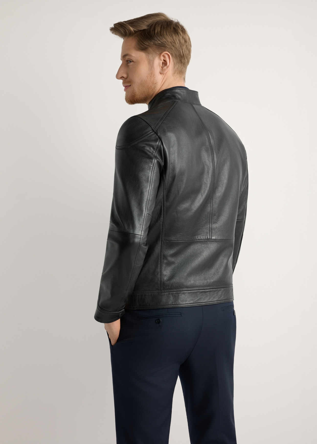 Men's leather jacket with stand-up collar KURMS-0301-99(W26), product view from the back on the model, half of the silhouette visible.