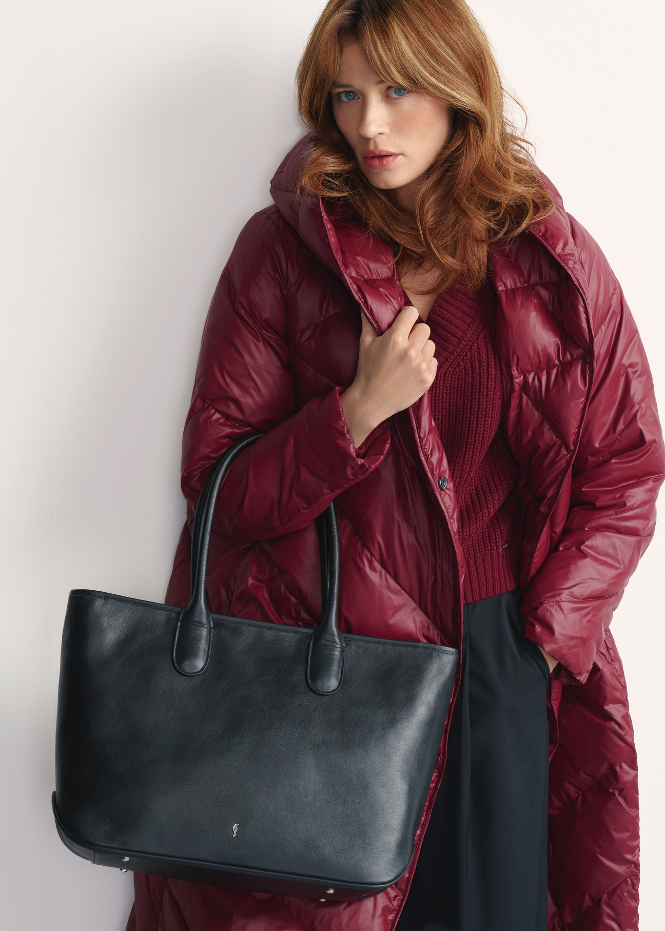 Large black leather handbag TORES-1149-99(Z25) - front view of the product on a model against a white background. Half of the silhouette visible.
