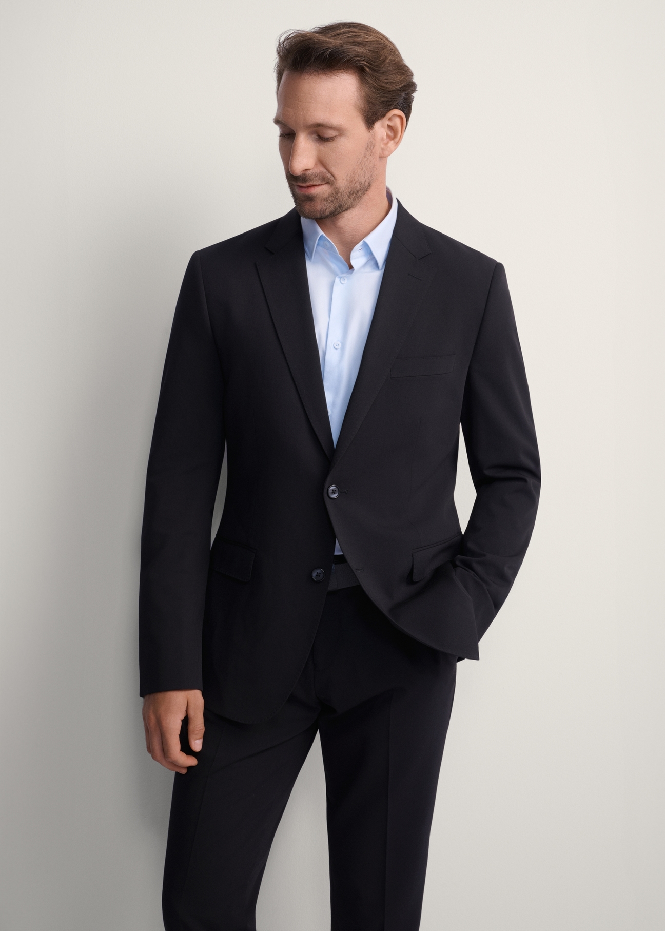 Black men's jacket MARMT-0019-99(Z25), front view of the product on the model, half of the silhouette visible.