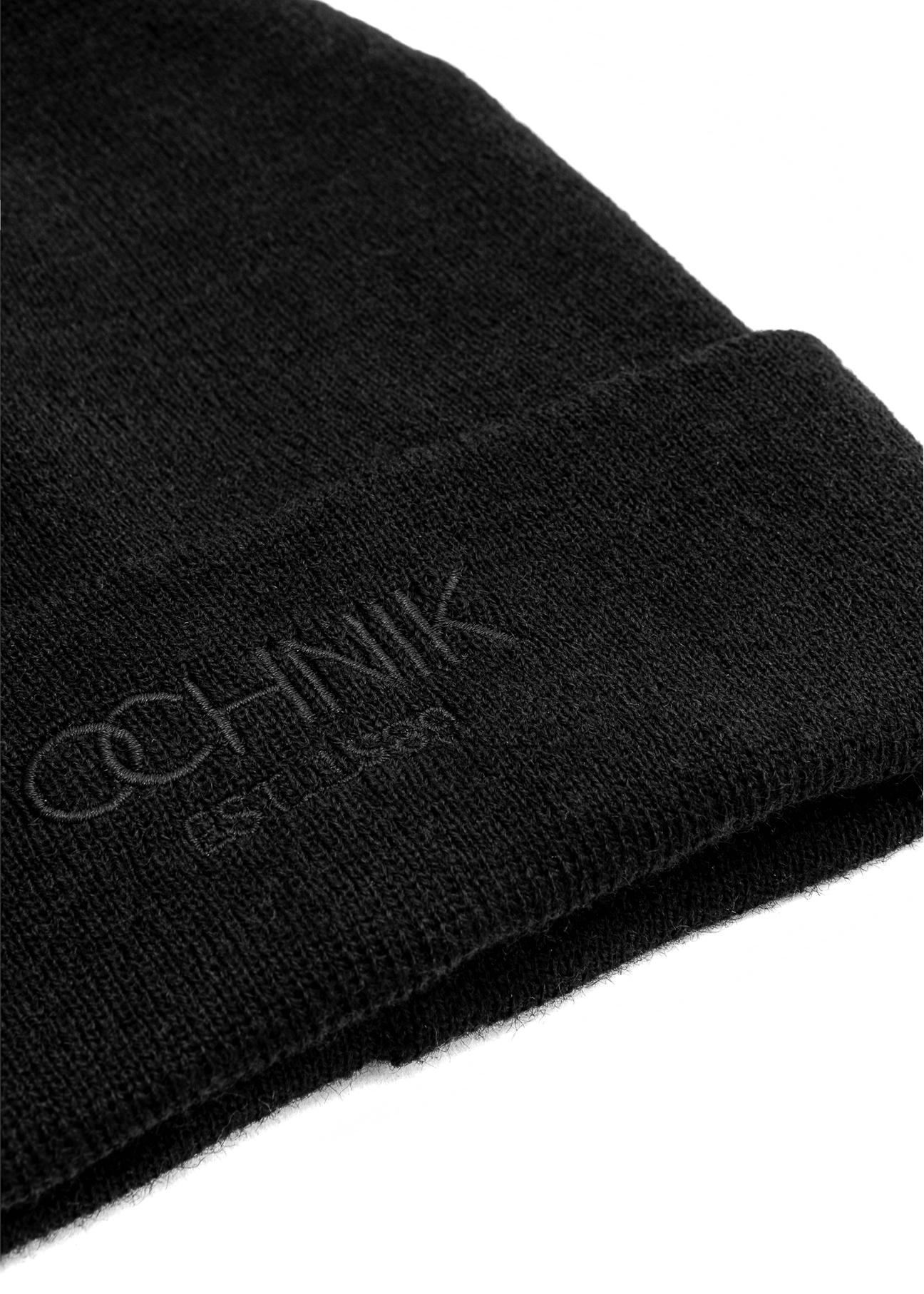 Black men's winter hat with OCHNIK CZAMT-0064A-99(Z25) logo, close-up of product detail, view on white background.
