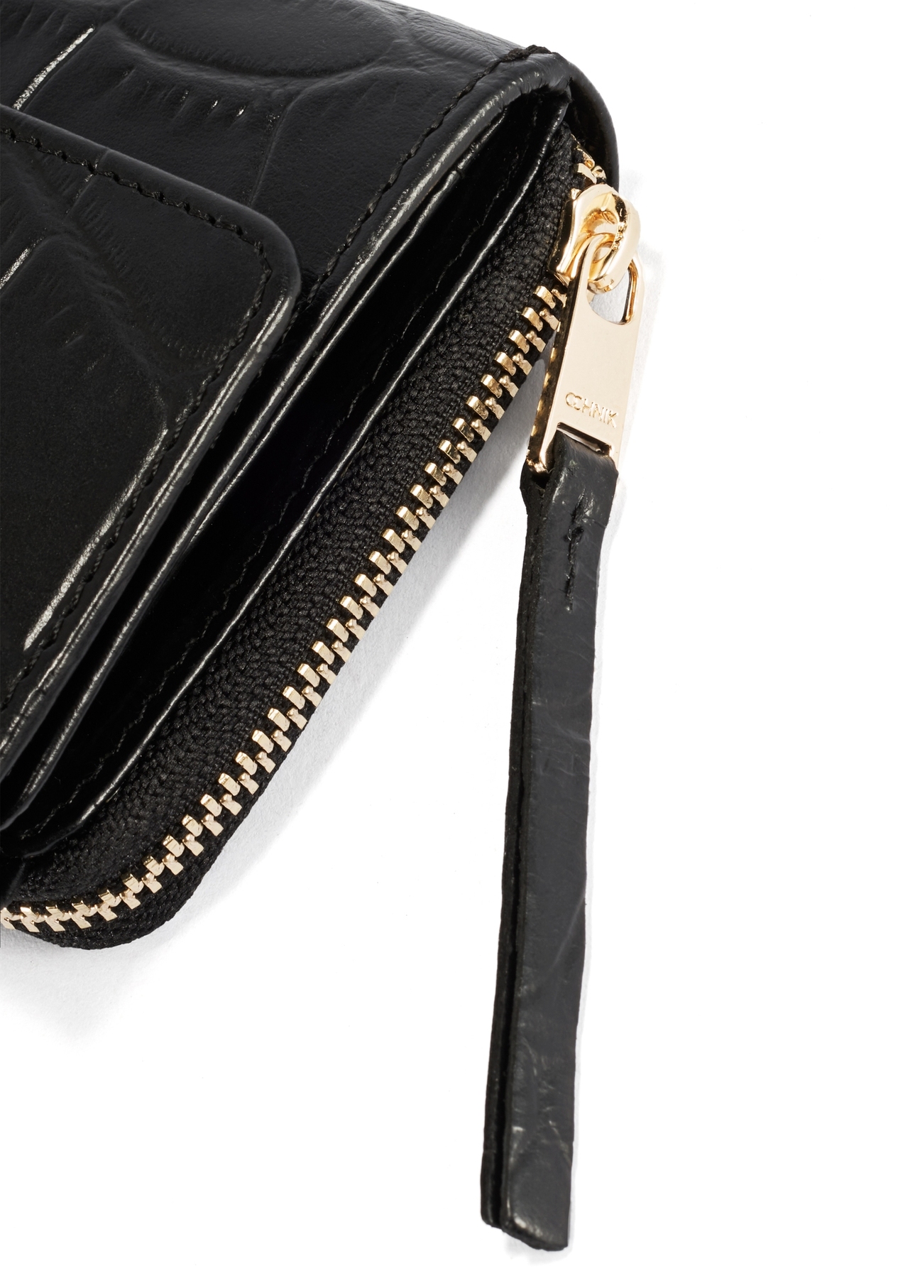 Black leather women's wallet PORES-0906A-97(Z25), close-up of the product detail, view on a white background.