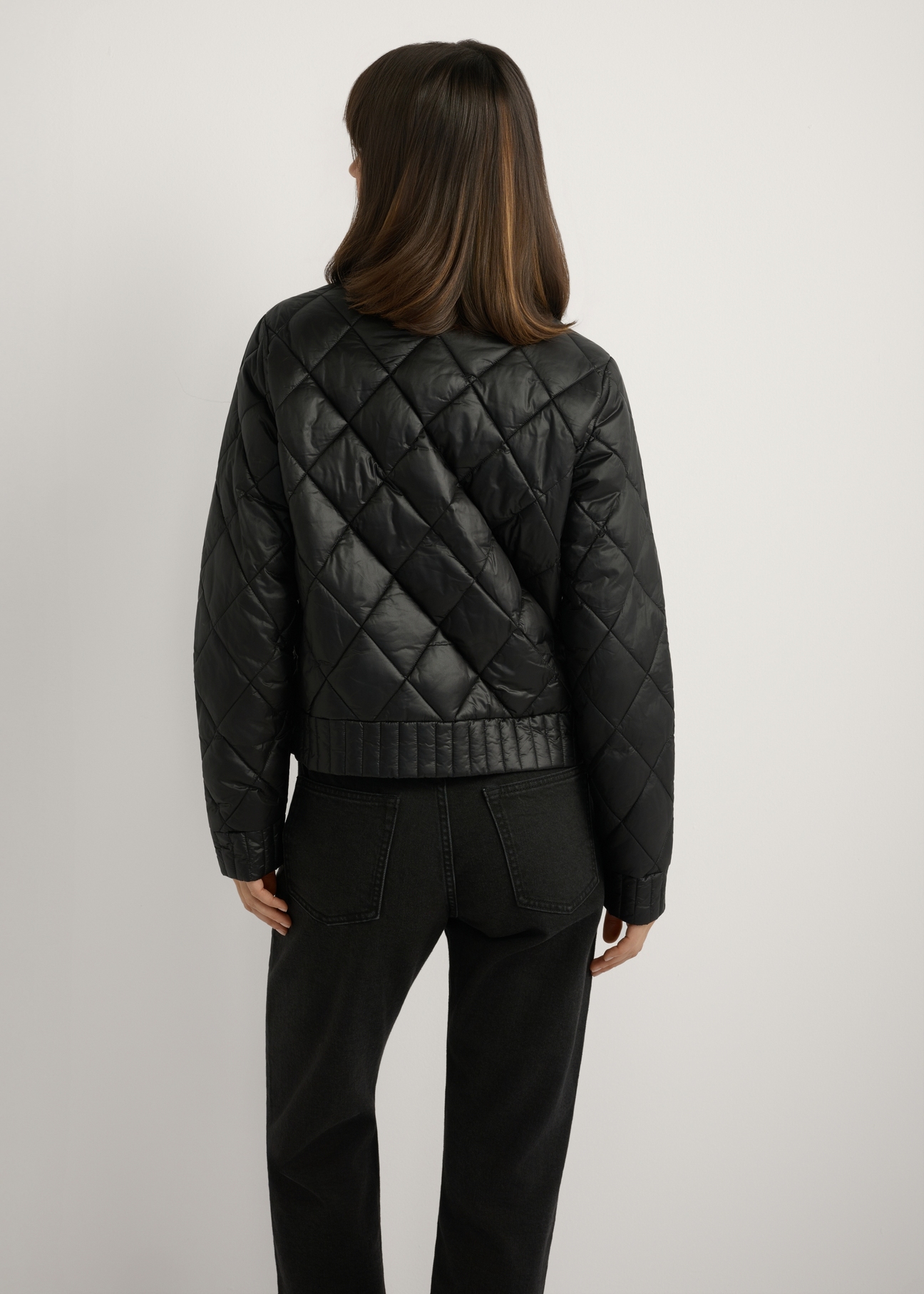 Women's black transitional jacket KURDT-0564A-99(W26), back view of the product on the model. Half of the silhouette visible.