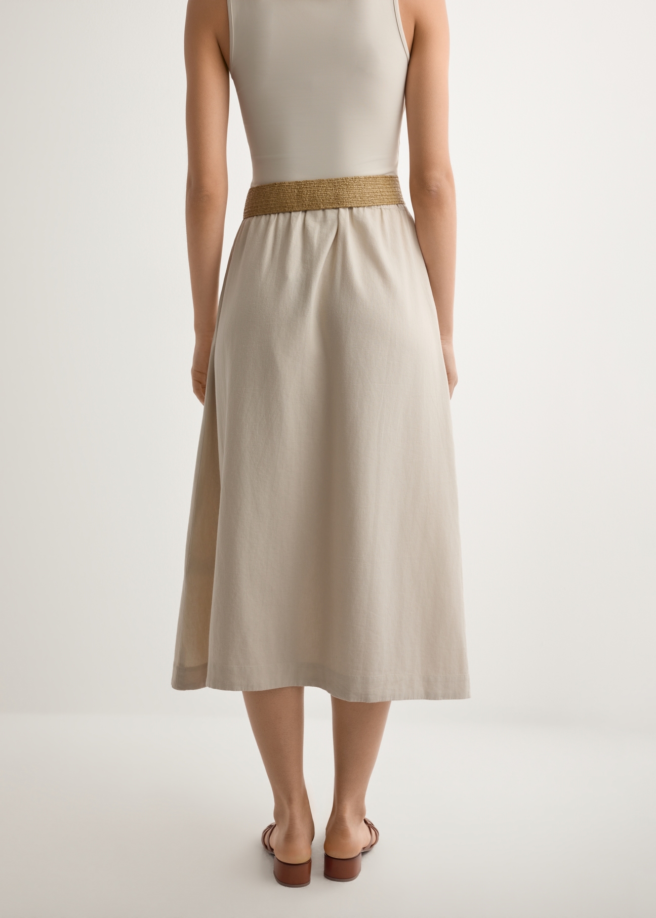 Beige viscose and linen skirt SPCDT-0124-1A(W26), back view of the product on the model. Half of the silhouette visible.