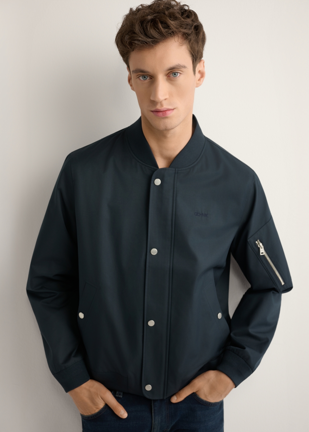 Men's navy transitional jacket KURMT-0403-7D(W26), front product view on model. Half silhouette visible.