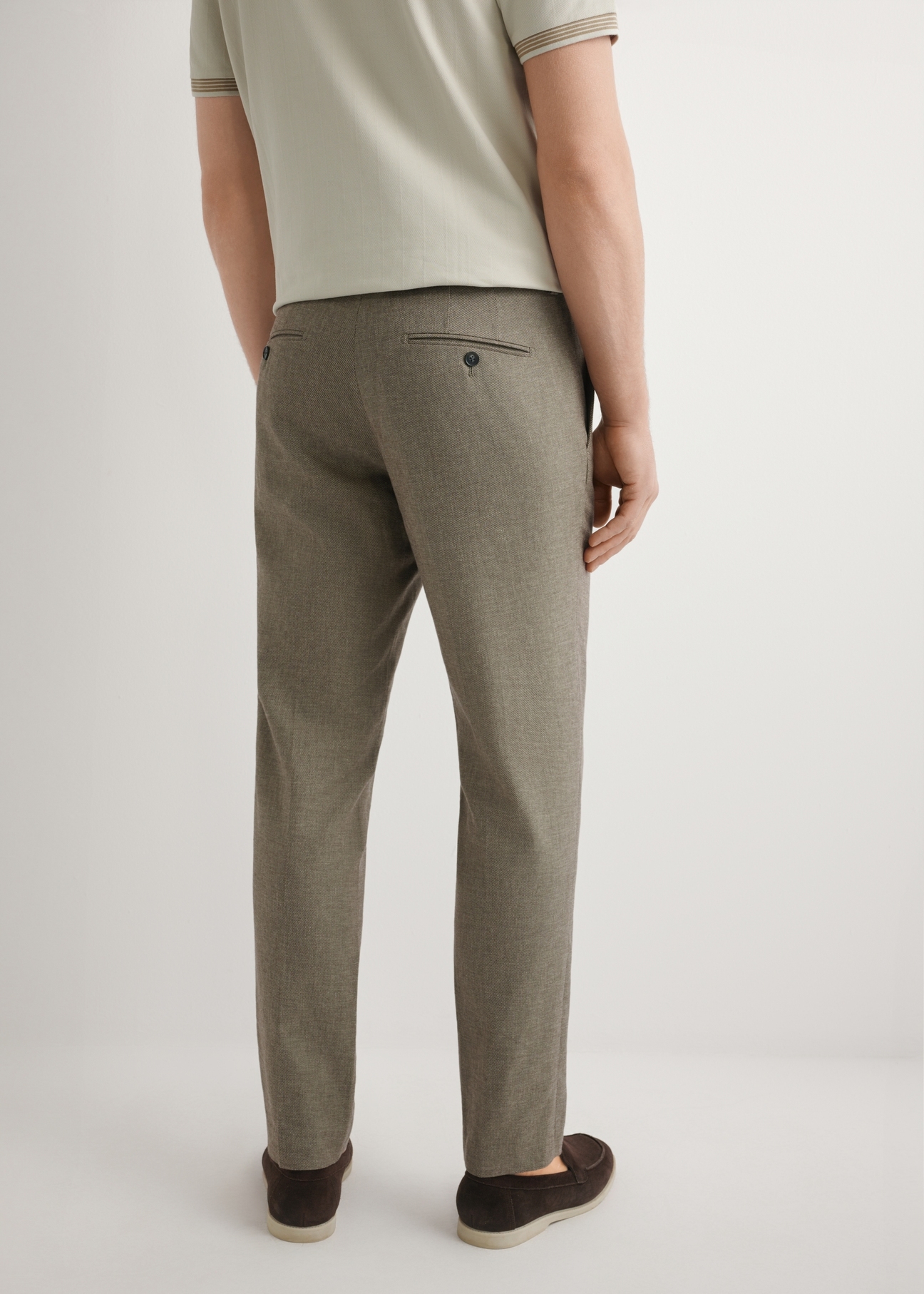 Men's dark brown suit trousers SPOMT-0098-1I(W26), product view from the back on the model. Half of the silhouette visible.