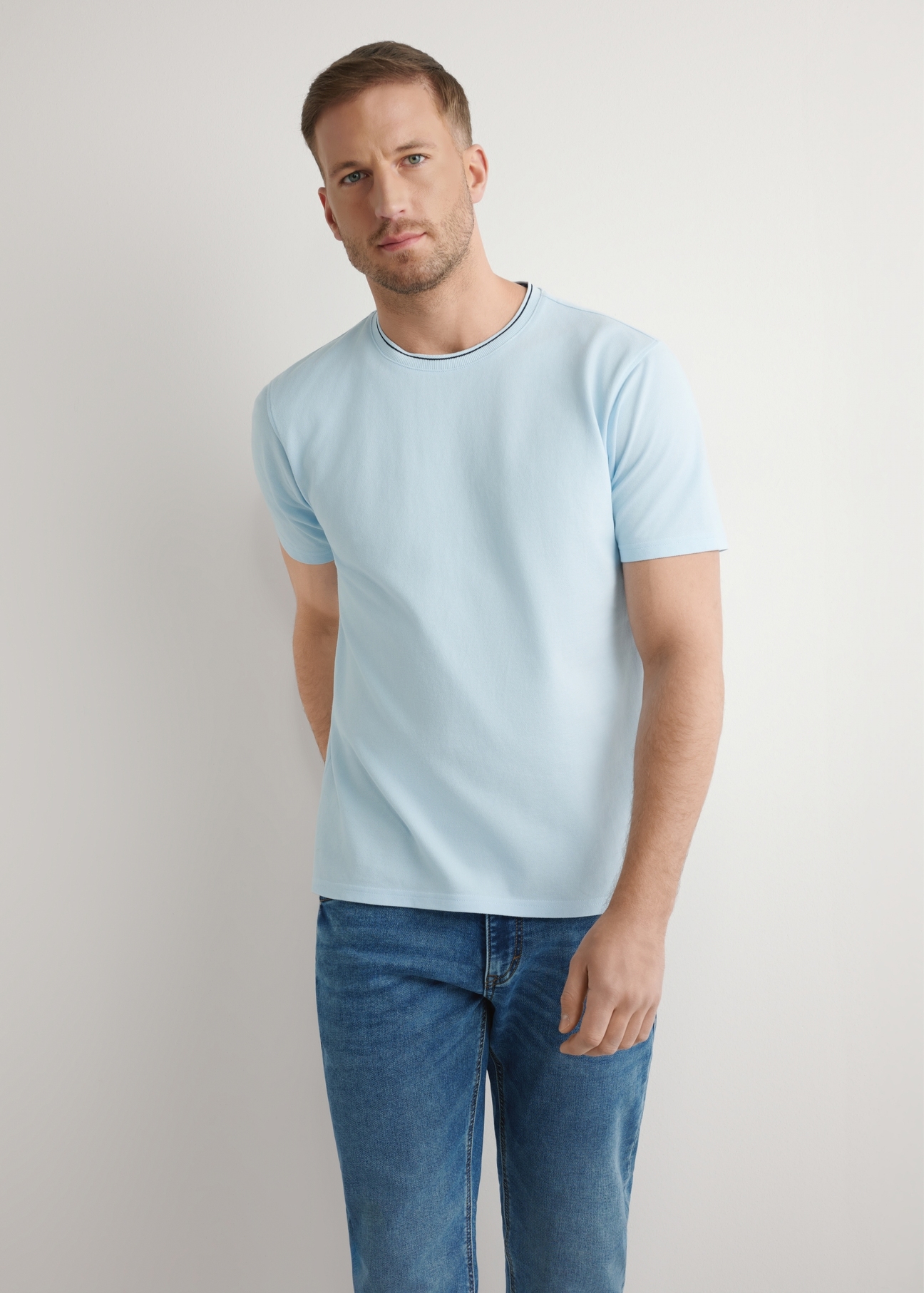 Men's light blue cotton T-shirt TSHMT-0150-7A(W26), front view of the product on the model. Half of the silhouette visible.