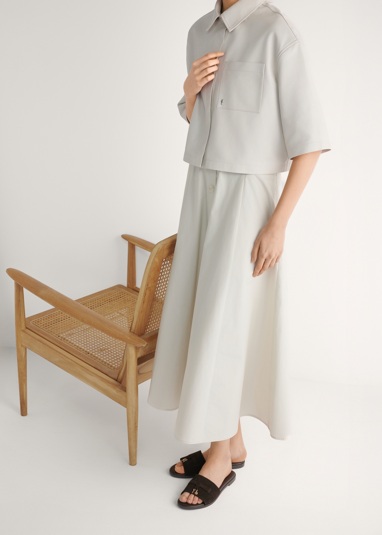 Women's suede slides in dark brown BUTYD-1255-1I(W26), side view of the product on the model's feet.