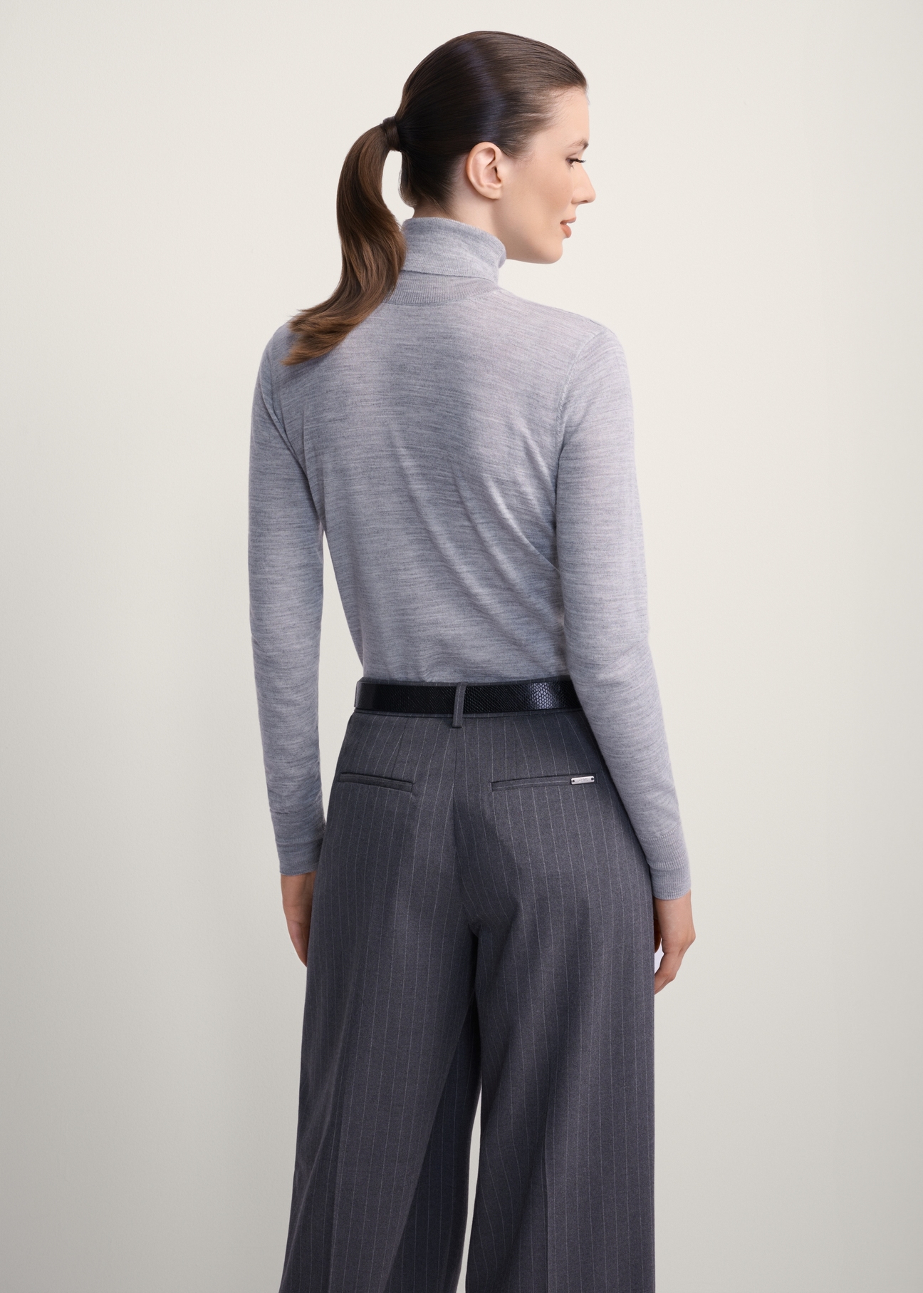 Women's gray wool turtleneck sweater SWEDT-0255-91(Z25), product view from the back on the model, half of the silhouette visible.