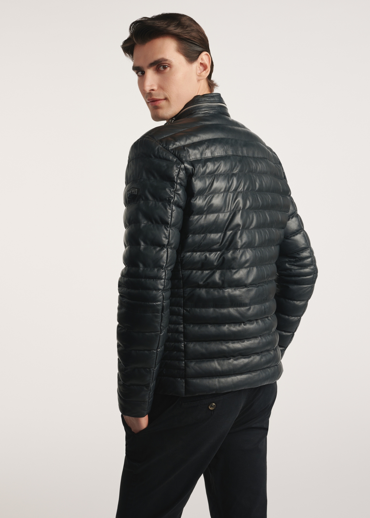 Black men's insulated leather jacket KURMS-0379-3358(Z25), product visible from the back on the model, half of the silhouette visible.