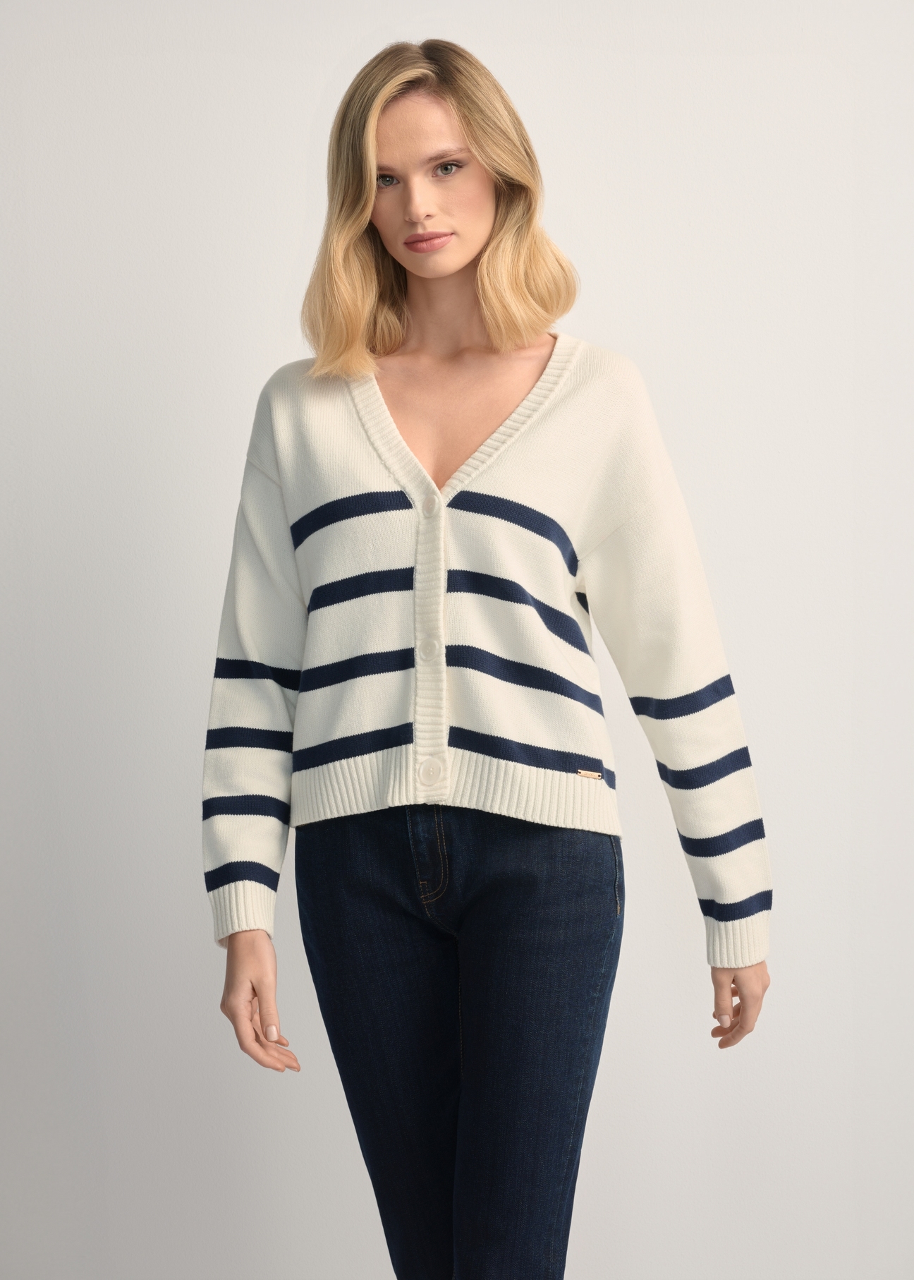 Women's cream striped cardigan KARDT-0060-0P(W26), front view of the product on the model. Half of the silhouette visible.