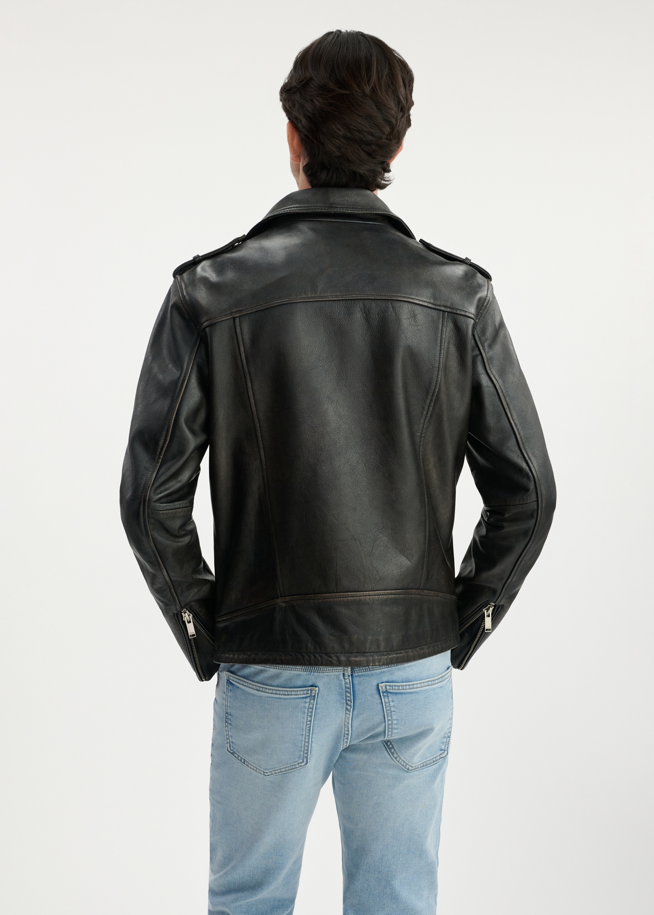 Men's vintage leather jacket KURMS-0370-1316(W25) - back view on model on white background. Half of the silhouette visible.
