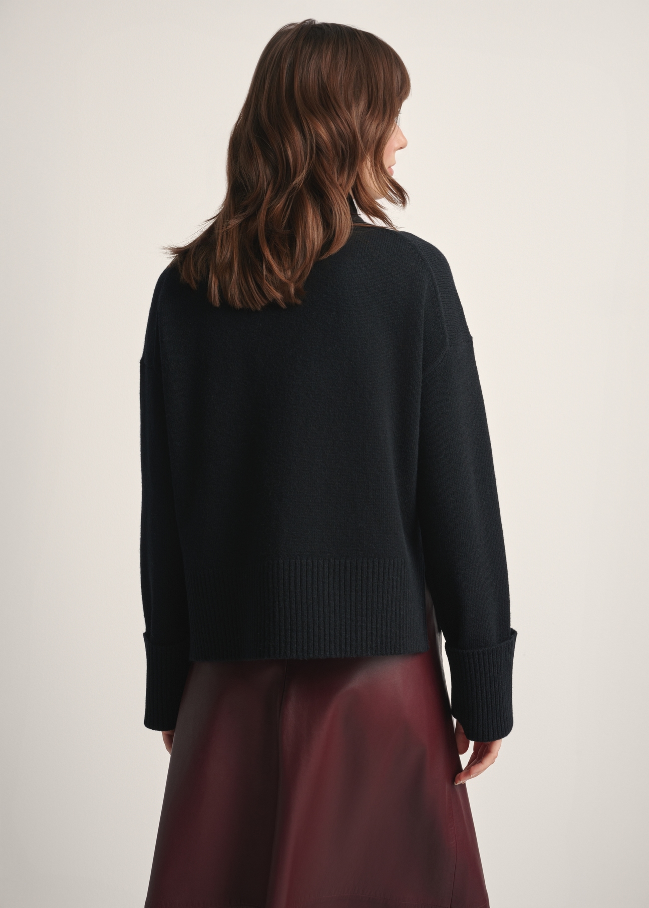 Women's black wool sweater SWEDT-0244-99(Z25), back view of the product on the model. Half of the silhouette visible.