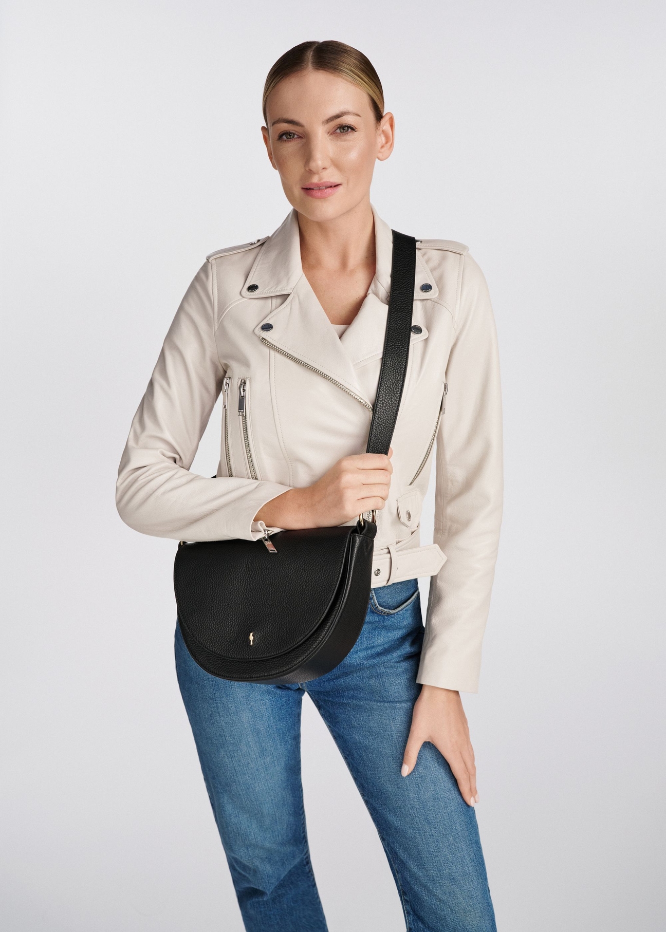 Black leather women's handbag TORES-0895D-99(Z25), view on a model. Half of the silhouette visible.