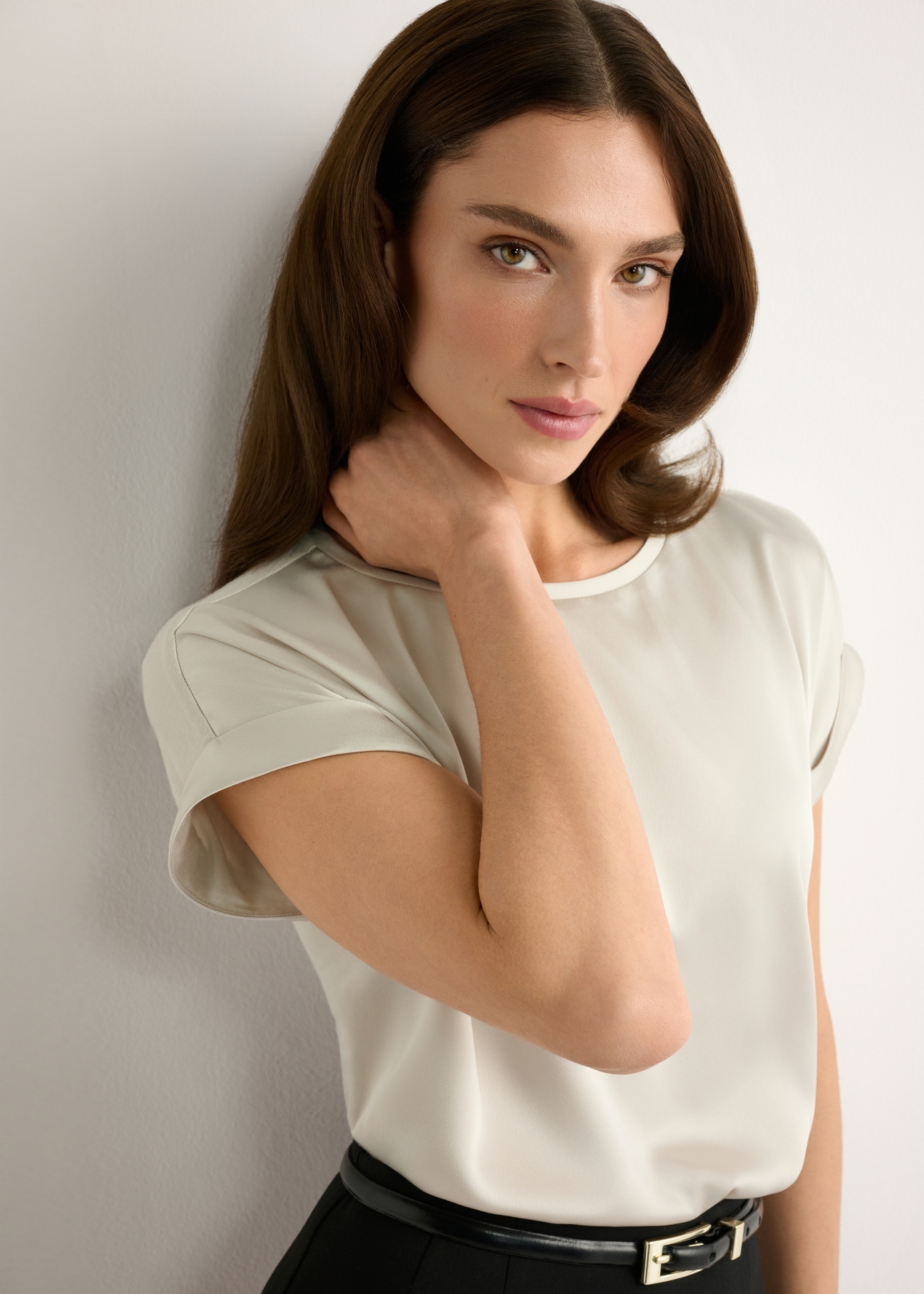 Light beige women's blouse BLUDT-0205-1A(W26), close-up of the product on the model's silhouette.