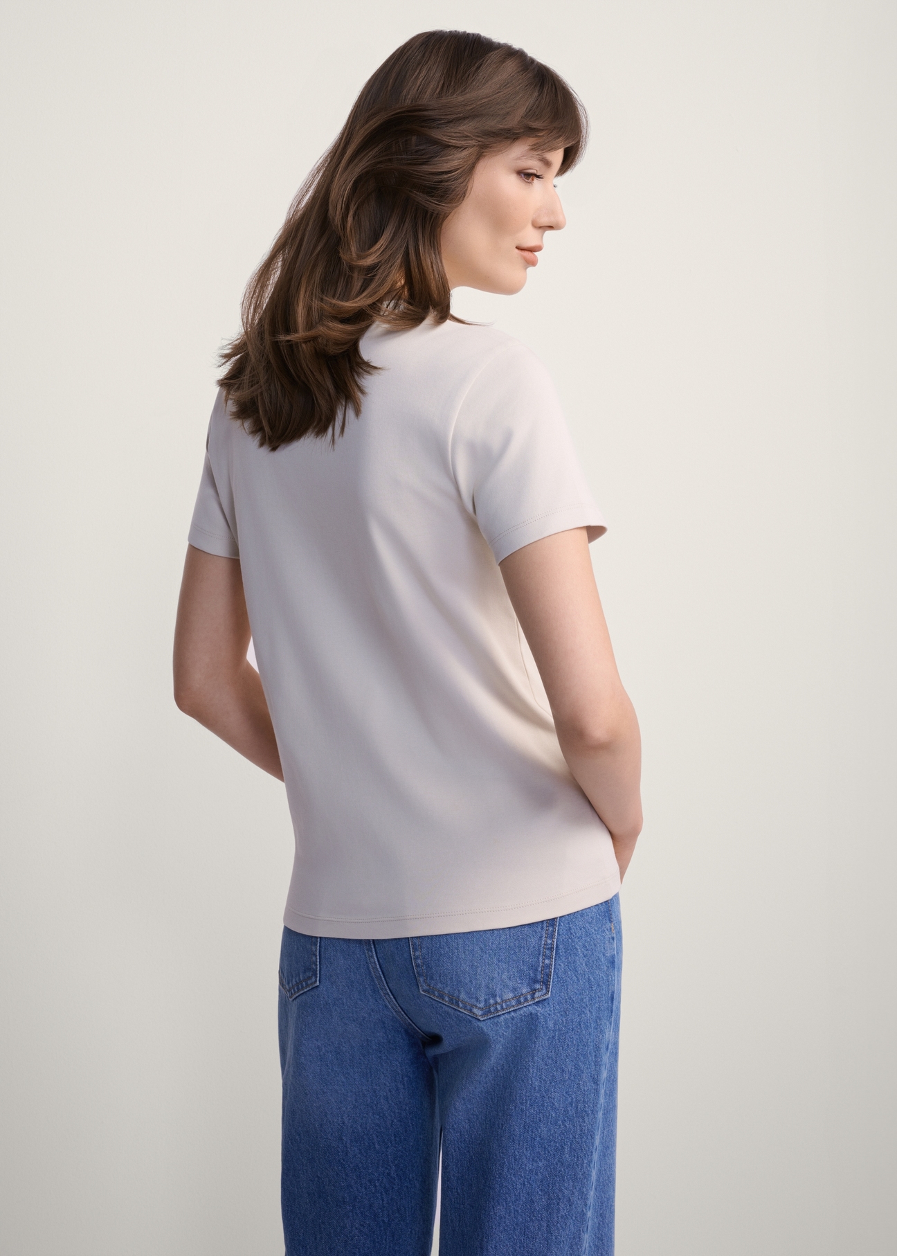 Beige cotton women's T-shirt TSHDT-0144-80(Z25), product view from the back on the model, half of the silhouette visible.
