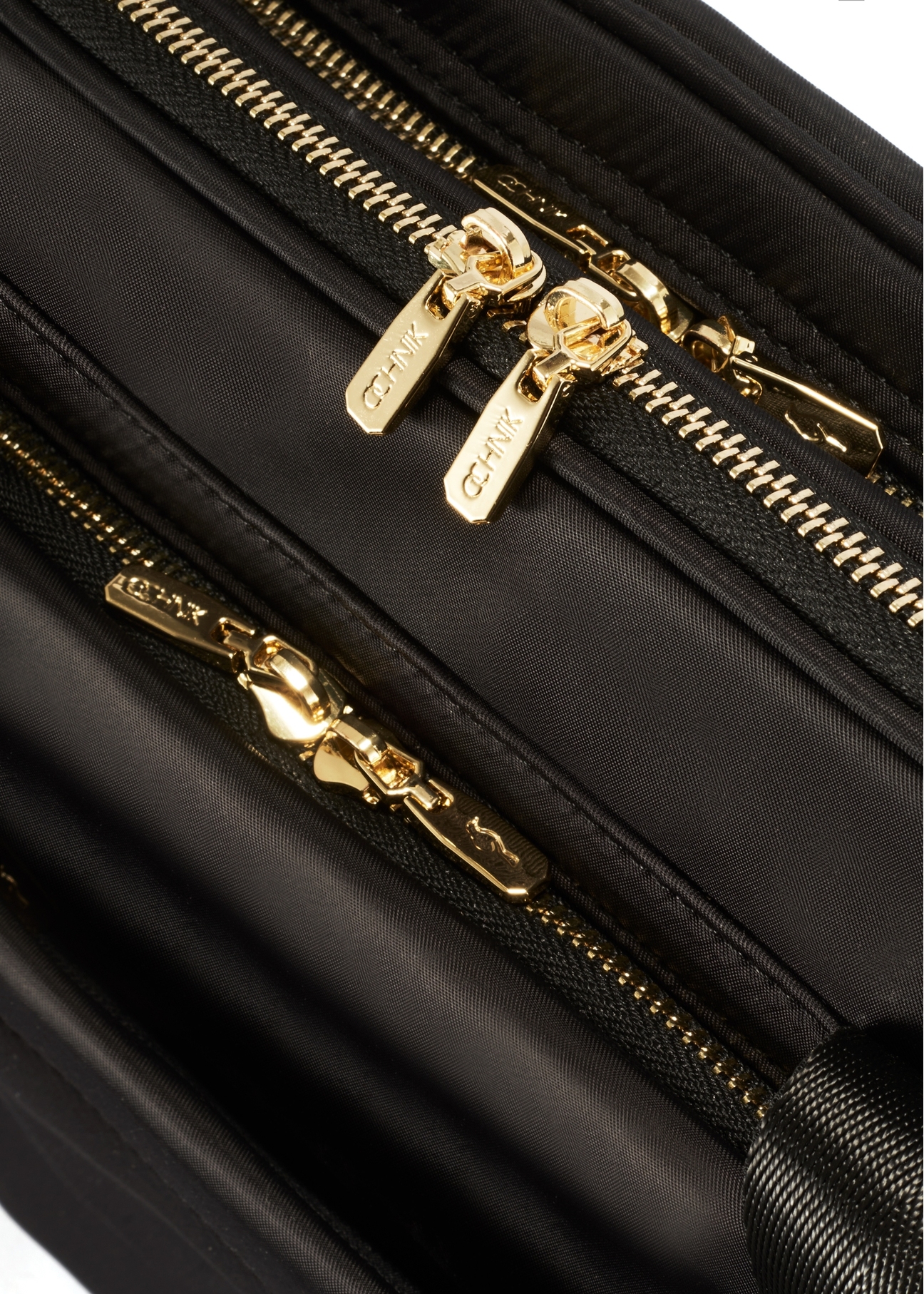 Black spacious women's laptop bag TOREN-0320-99(Z25), close-up of the product zipper, view on a white background.