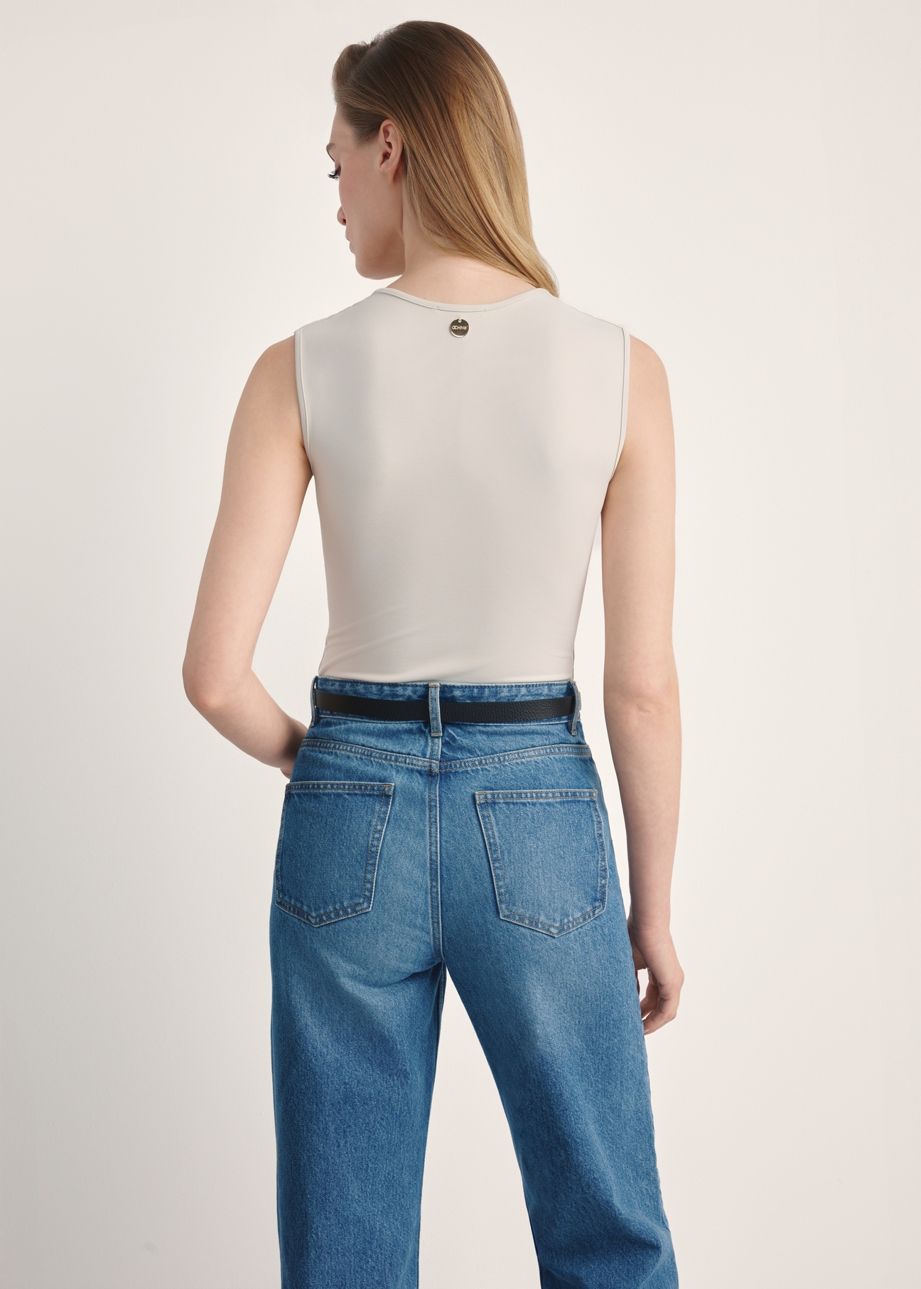 Light beige women's bodysuit BODYT-0002-80(Z25), product visible from the back on the model, half of the silhouette visible.
