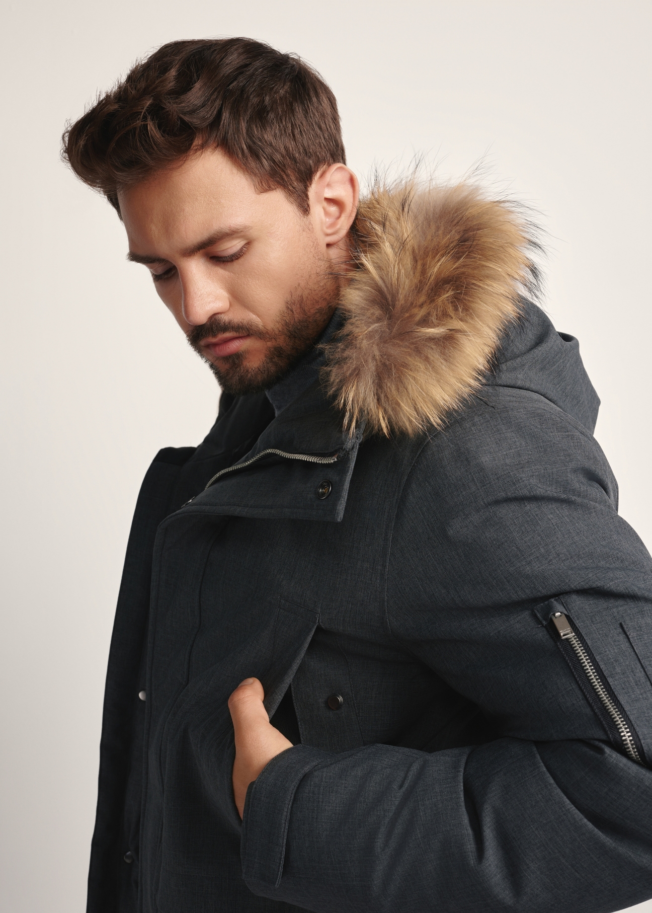 Men's winter jacket in graphite color KURMT-0395-95(Z25) - close-up of the product on the model on a white background.