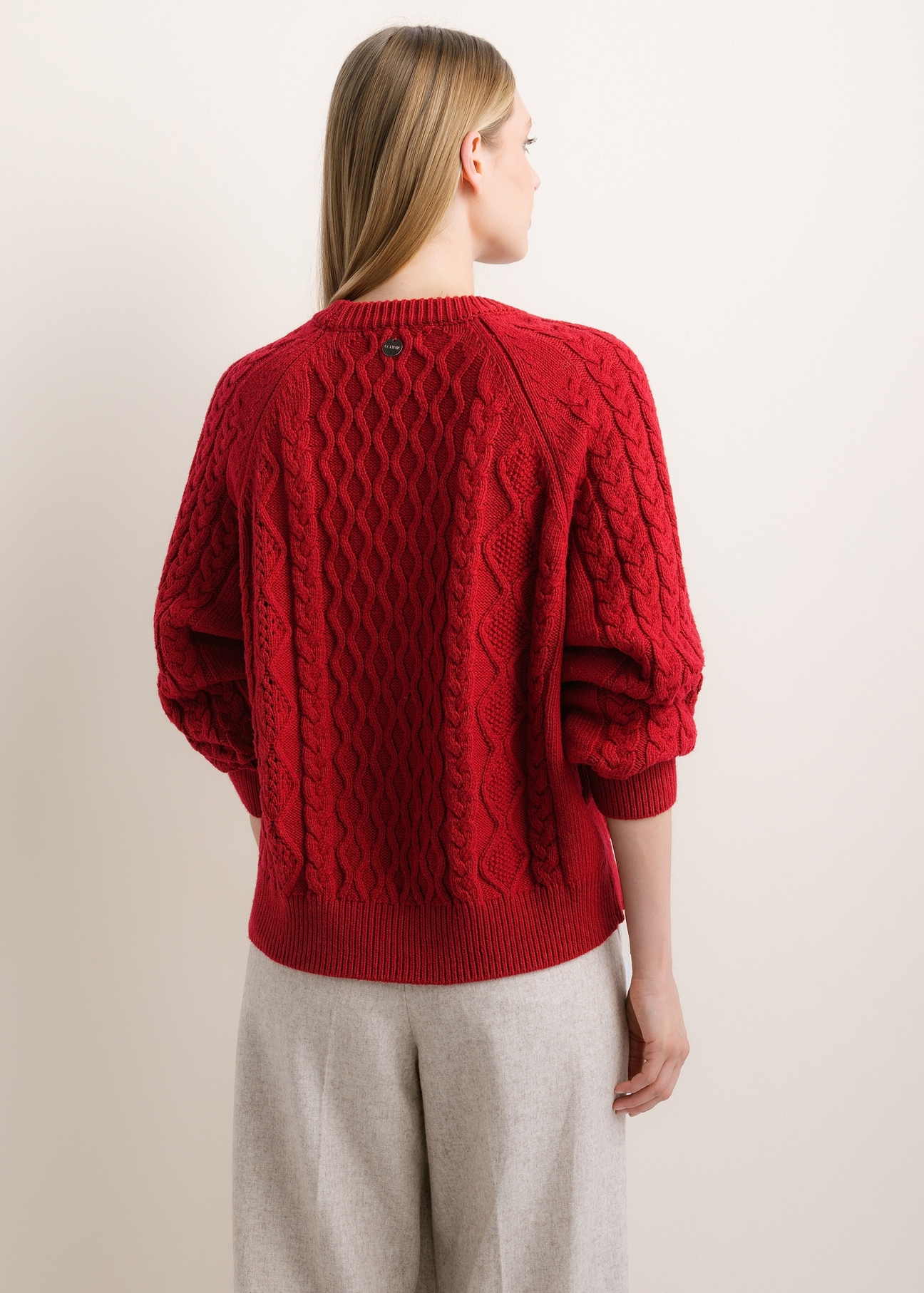 Dark red women's sweater SWEDT-0277-4C(Z26), product view from the back on the model. Half of the silhouette visible.