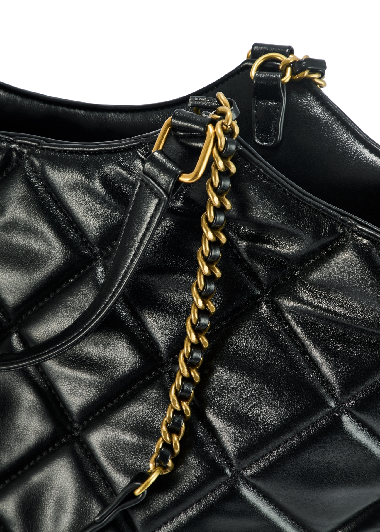 Black quilted women's handbag TOREC-1057-99(Z25), close-up of the product handle, view on a white background.