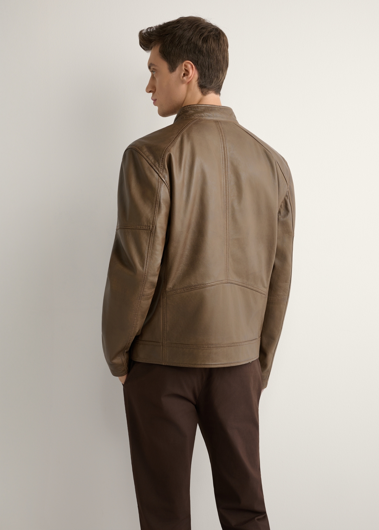 Brown men's leather jacket KURMS-0400-1H(W26), product view from the back on the model. Half of the silhouette visible.