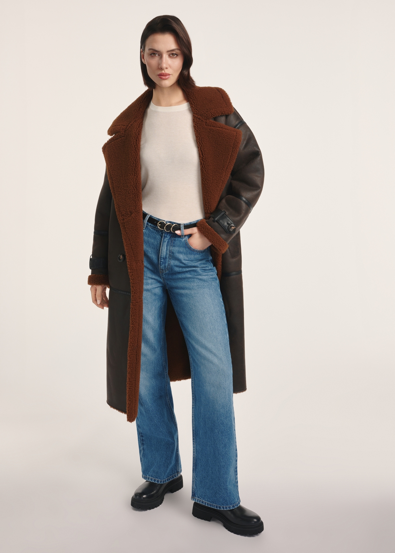 Long brown women's sheepskin coat KOZDP-0014-90(Z25) - front view of the product on a model on a white background. The entire silhouette is visible.