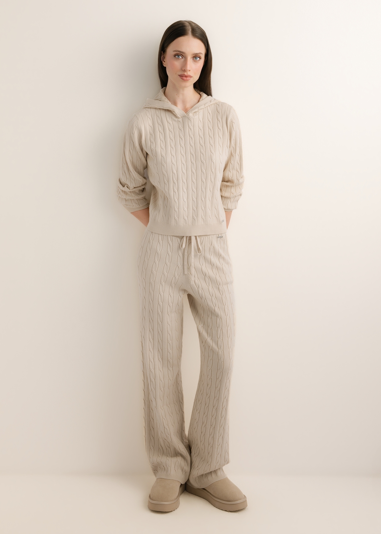 Light beige women's trousers SPODT-0131-1A(Z26), front view of the product on a model. Full-body view.