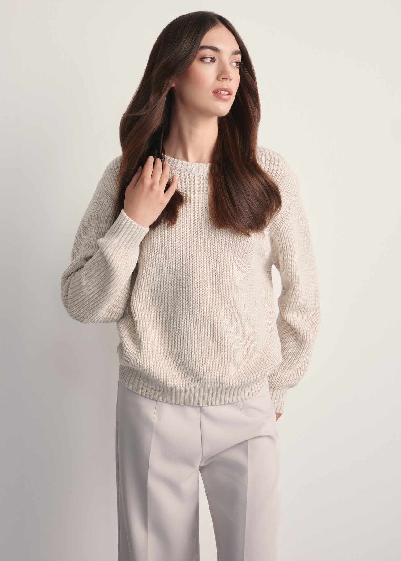 Beige women's sweater SWEDT-0238-81(Z25), front view of the product on the model. Half of the silhouette visible.