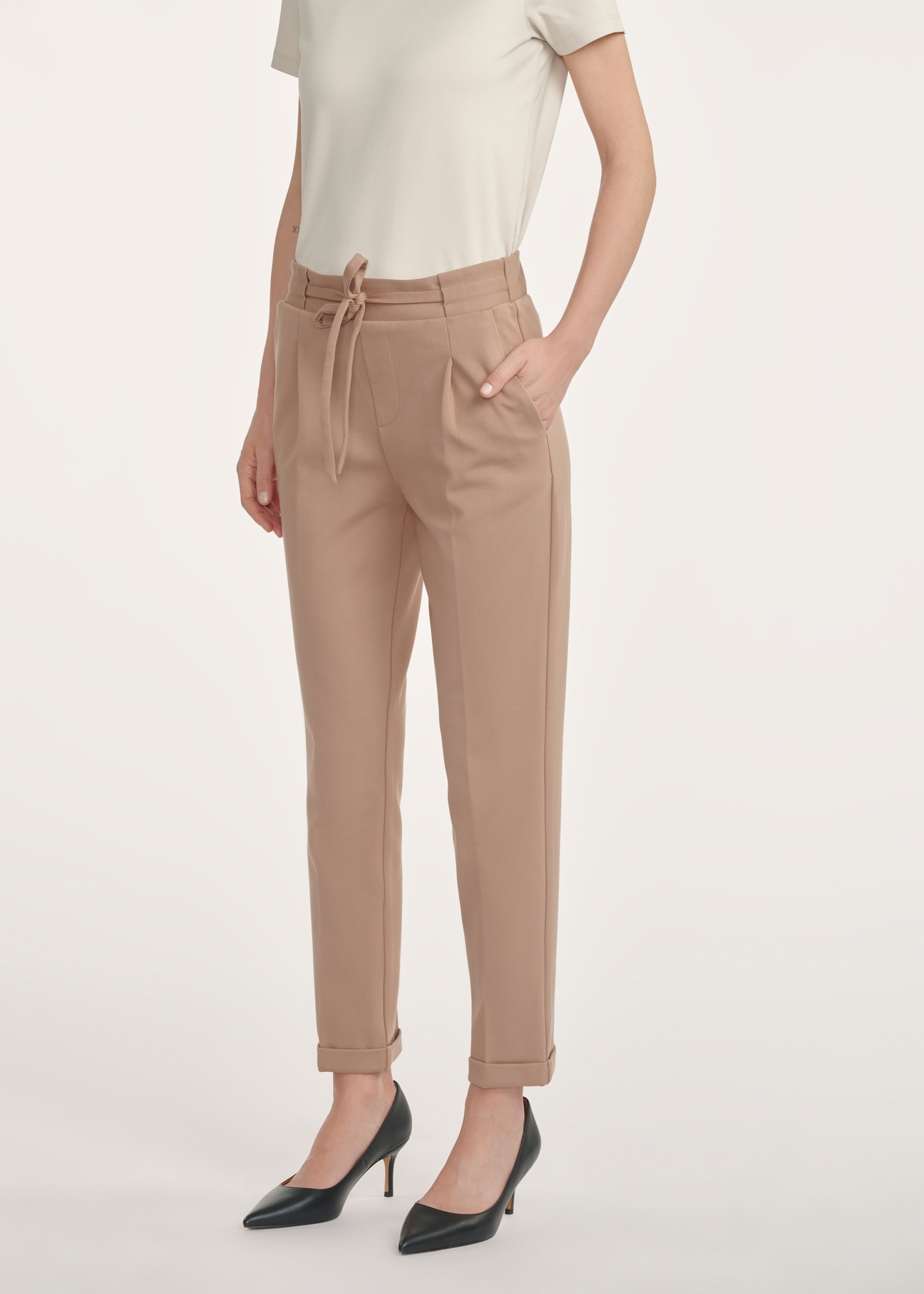 Women's camel trousers with a crease SPODT-0098-24(Z24), product view from the front on the model, half of the silhouette visible.
