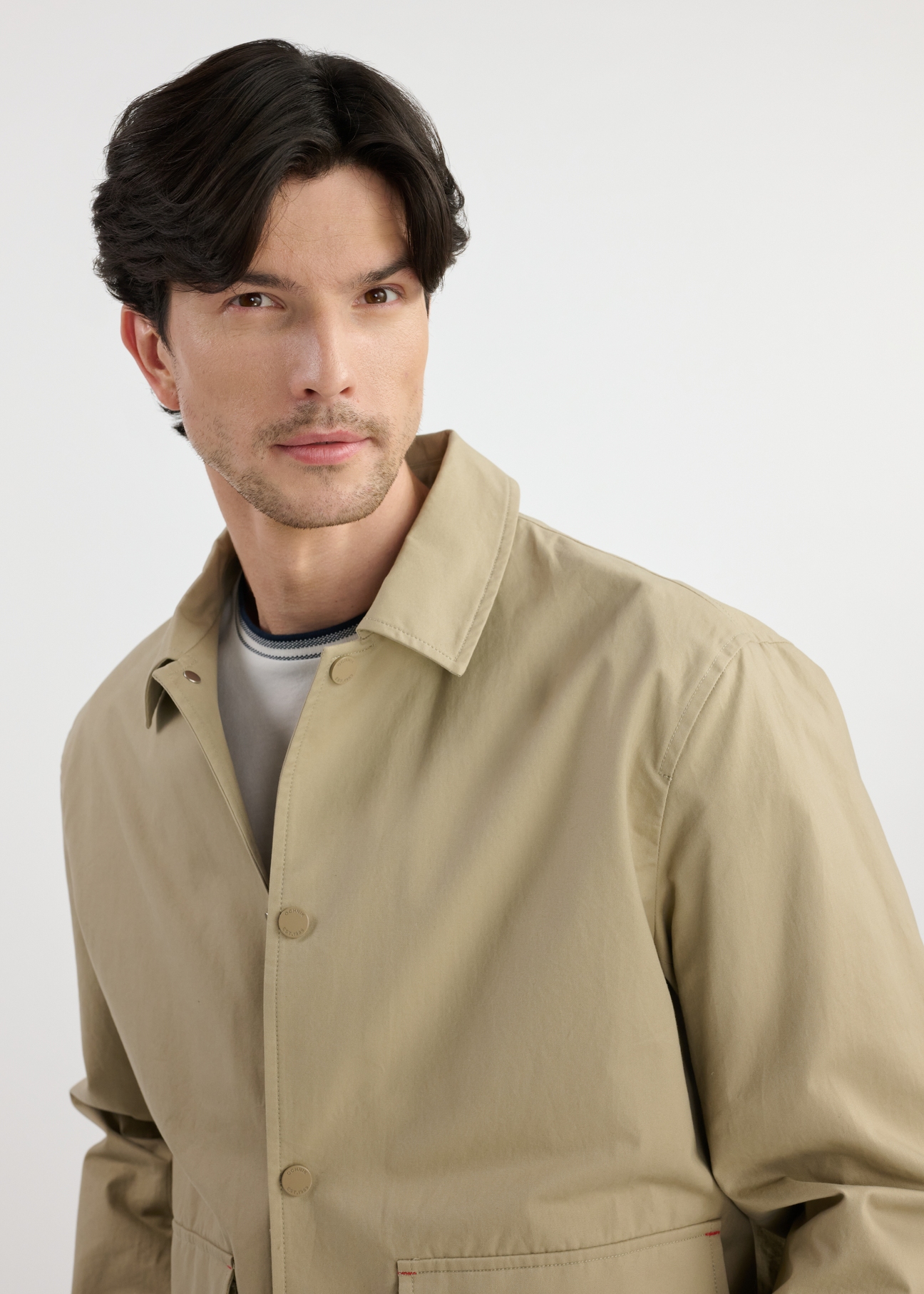 Beige men's transitional jacket KURMT-0365-82(W25) - close-up of the front on the model on a white background.