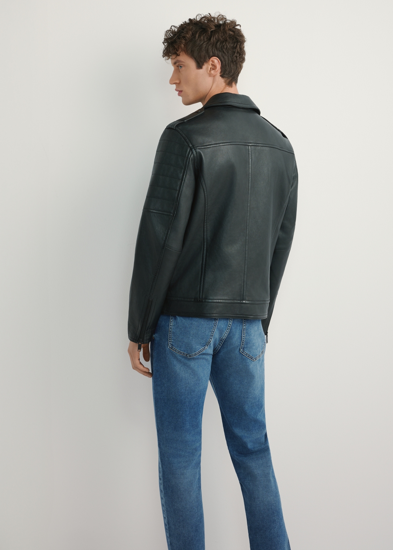 Men's black leather biker jacket KURMS-0391-99(W26), product view from the back on the model. Half of the silhouette visible.