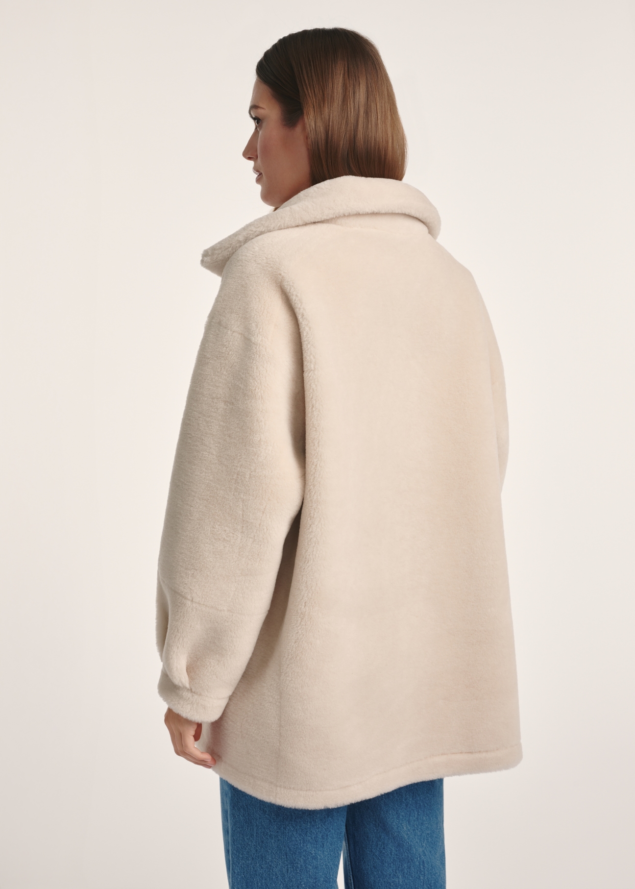 Women's double-sided sheepskin coat KOZDP-0009-24(Z24), product view from the back on the model, half of the silhouette visible.