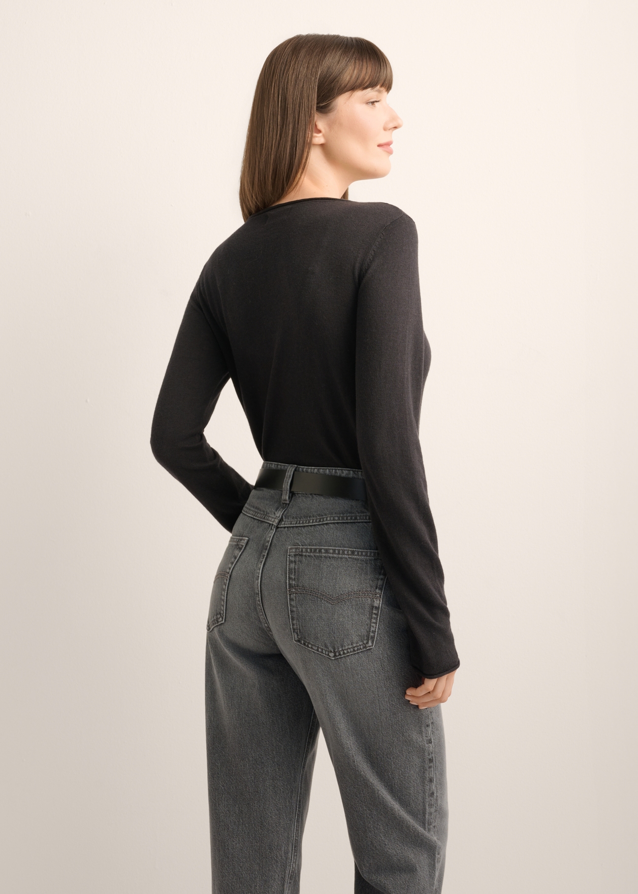 Black women's cashmere sweater SWEDT-0260-99(Z26), product view from the back on the model, half of the silhouette visible.