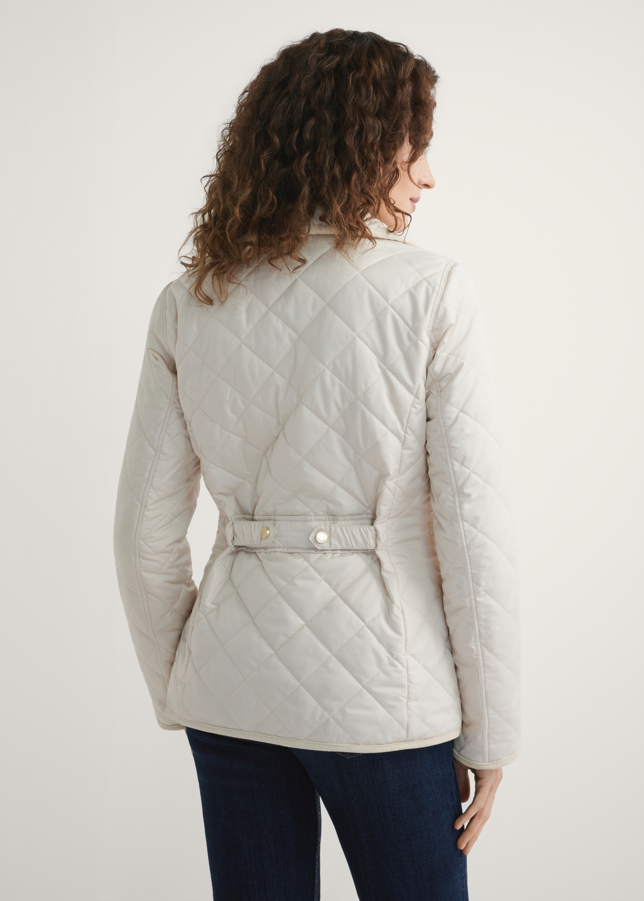 Light beige women's transitional jacket KURDT-0640-0B(W26) - product view from the back, against a light background. Half-length silhouette visible.