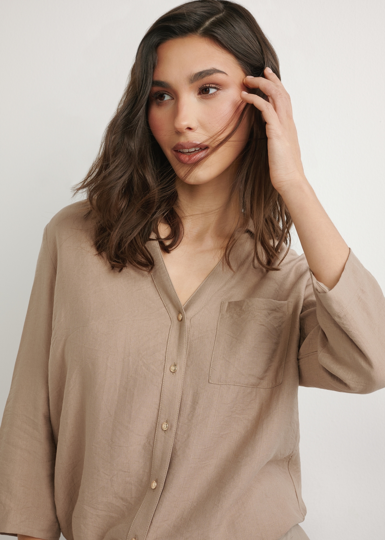 Dark beige women's shirt KOSDT-0157A-1D(W26), front view of the product on the model. Half of the silhouette visible.