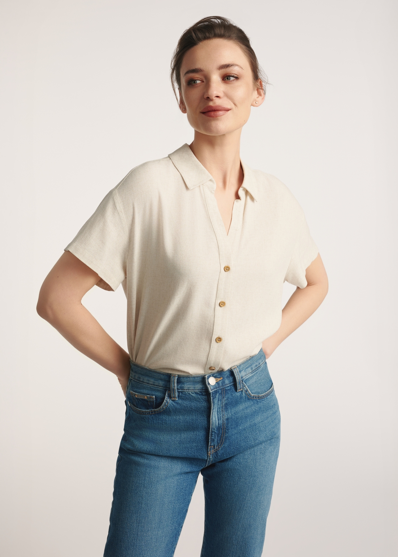 Beige women's linen shirt KOSDT-0179-81(W25) - front view of the product on the model. Half of the silhouette visible.
