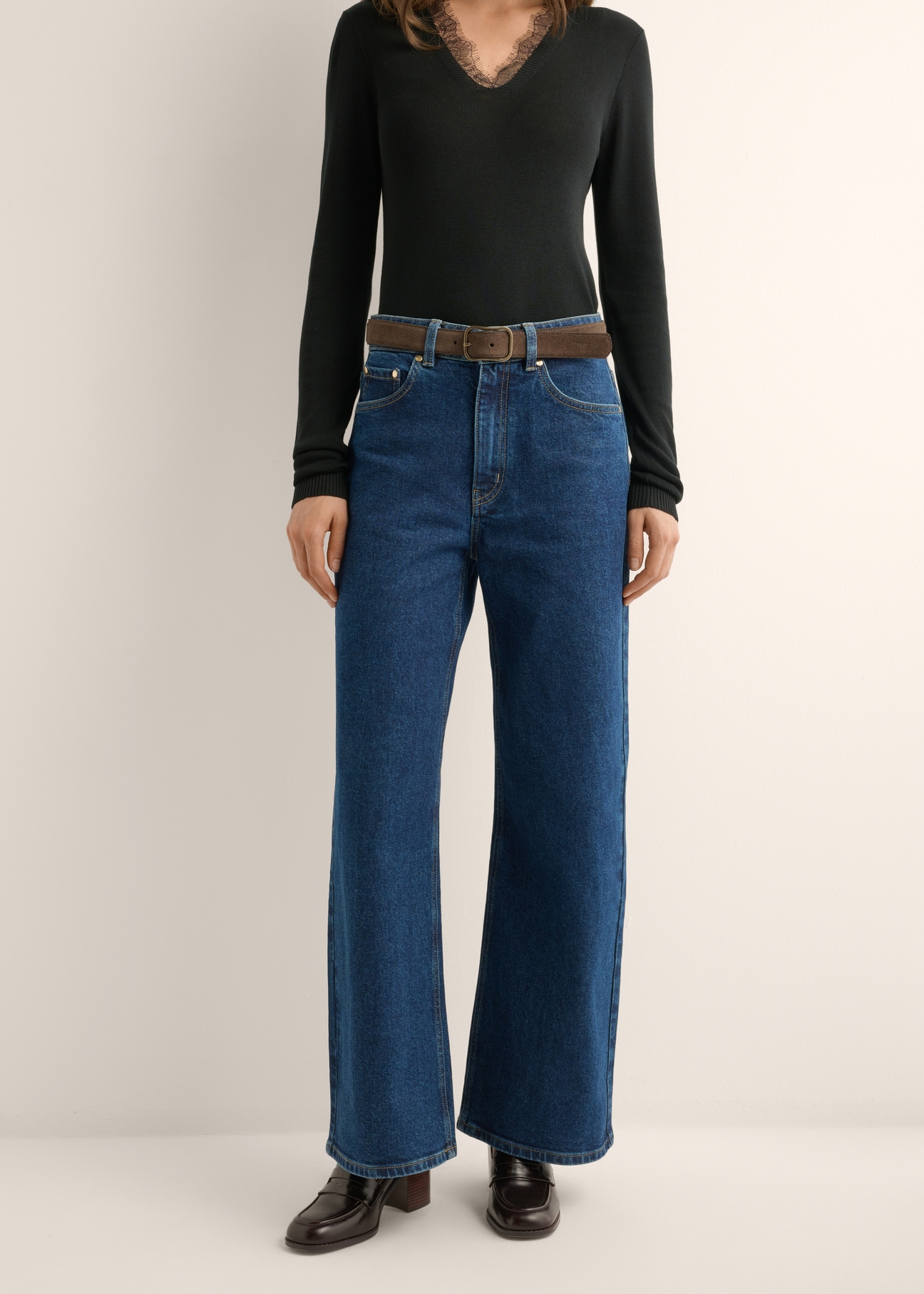 Women's navy blue denim pants JEADT-0013-7D(Z26) - front view of the product, on a model, against a light background. Half of the silhouette visible.