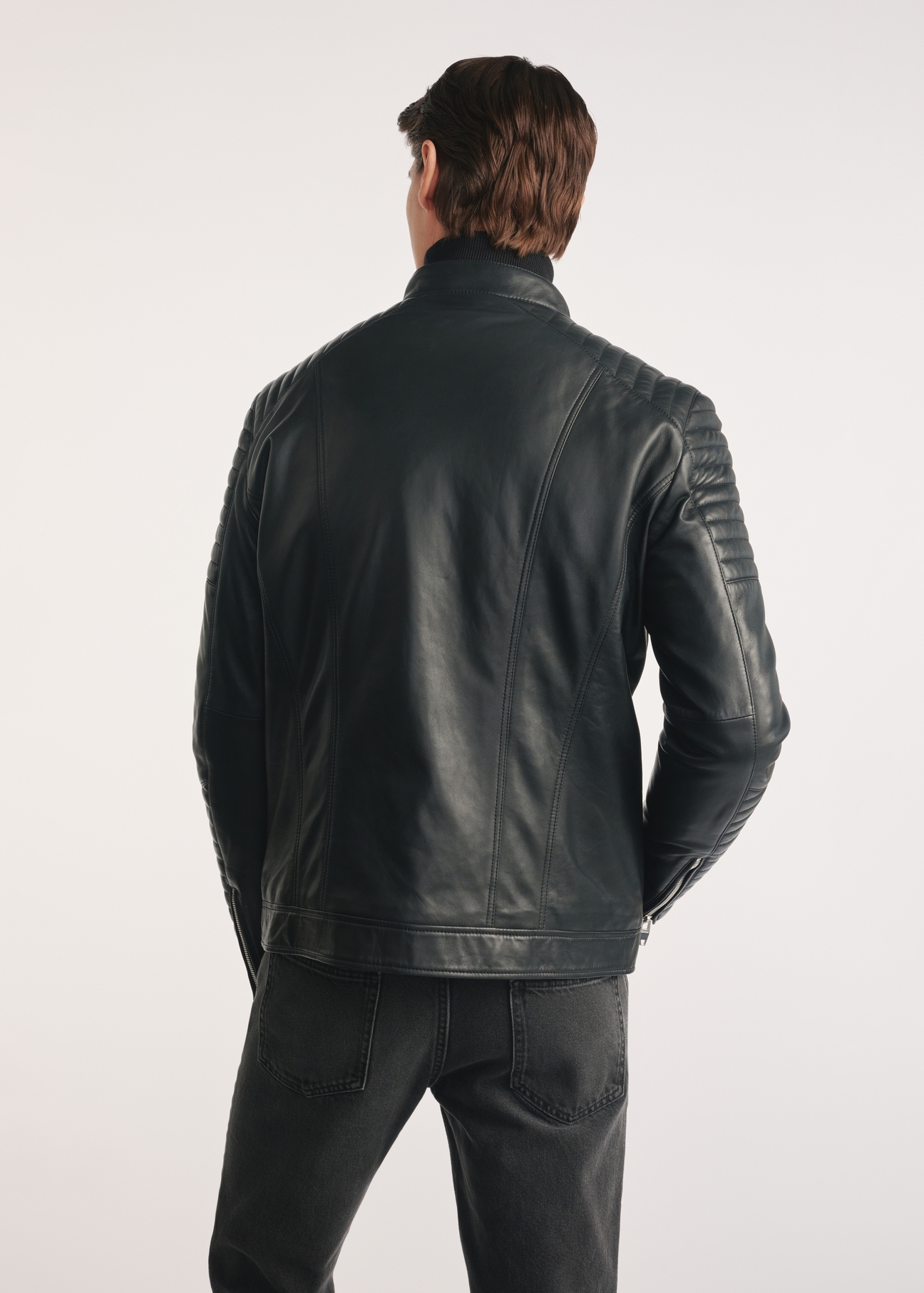 Black men's leather jacket KURMS-0382-1283(Z25), product visible from the back on the model, half of the silhouette visible.