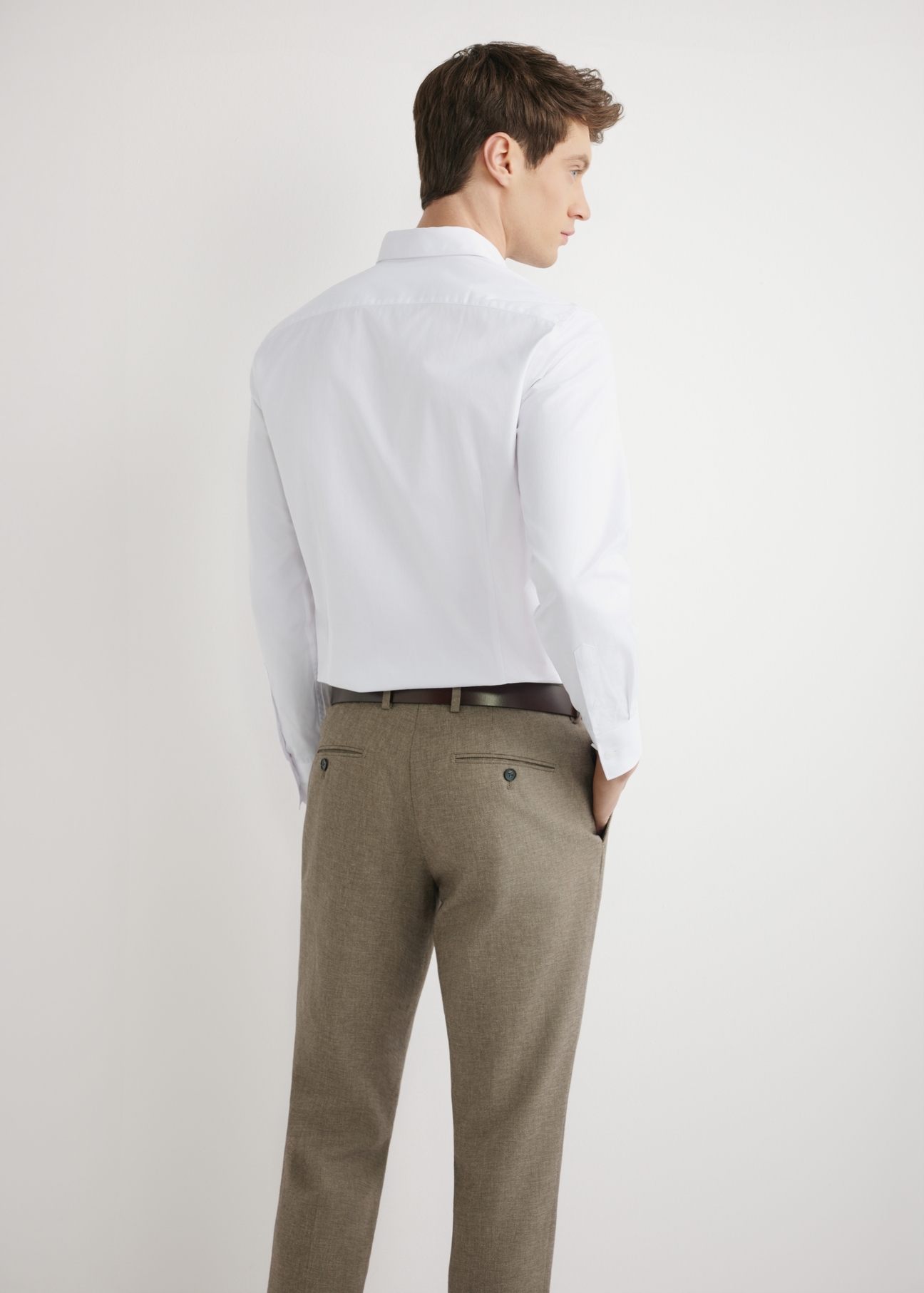 Men's white cotton shirt KOSMT-0358-0A(W26) - back view of the product, on a model, against a light background. Half-length silhouette visible.