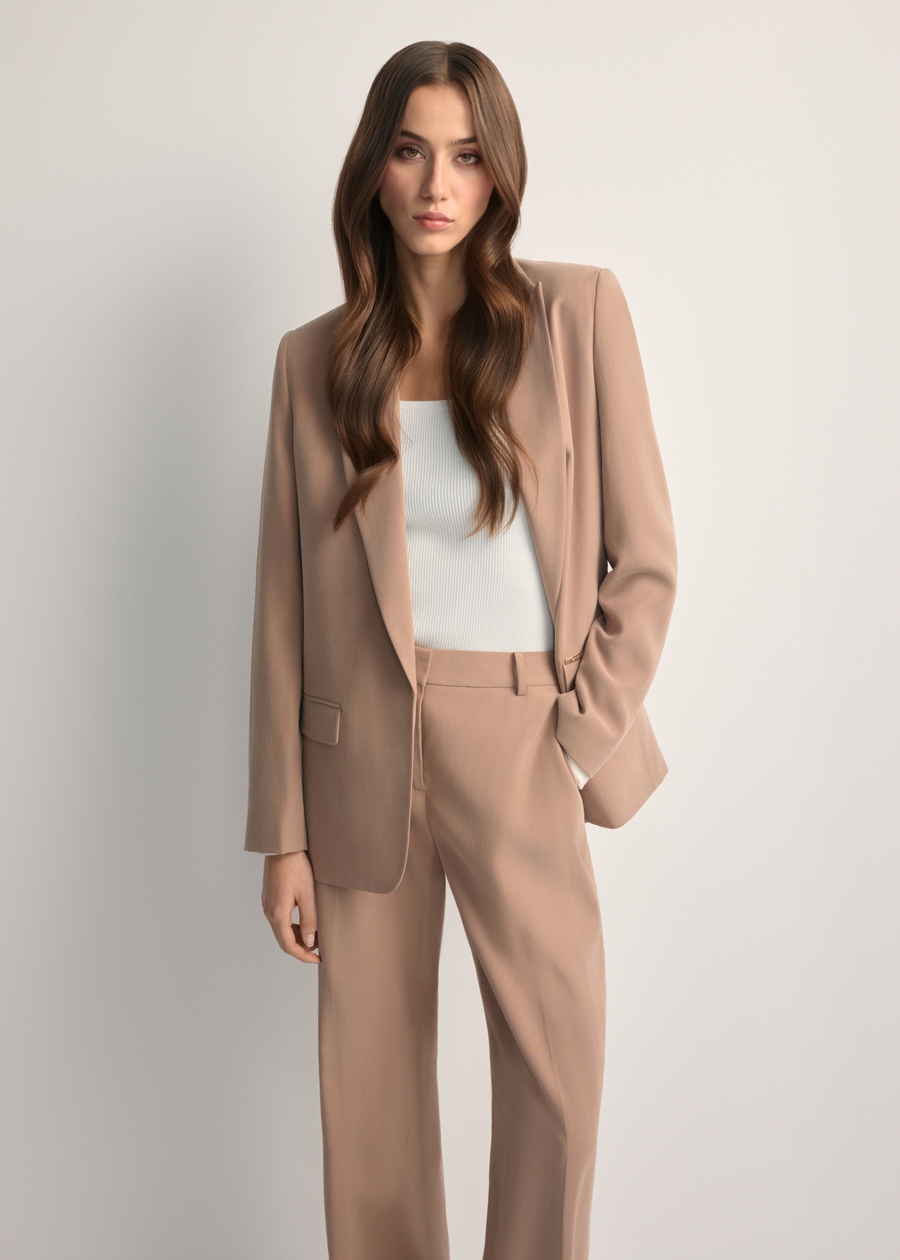 Women's camel blazer ZAKDT-0031A-1D(W26) - front view of the product, on a model, against a light background. Knee-length silhouette visible.