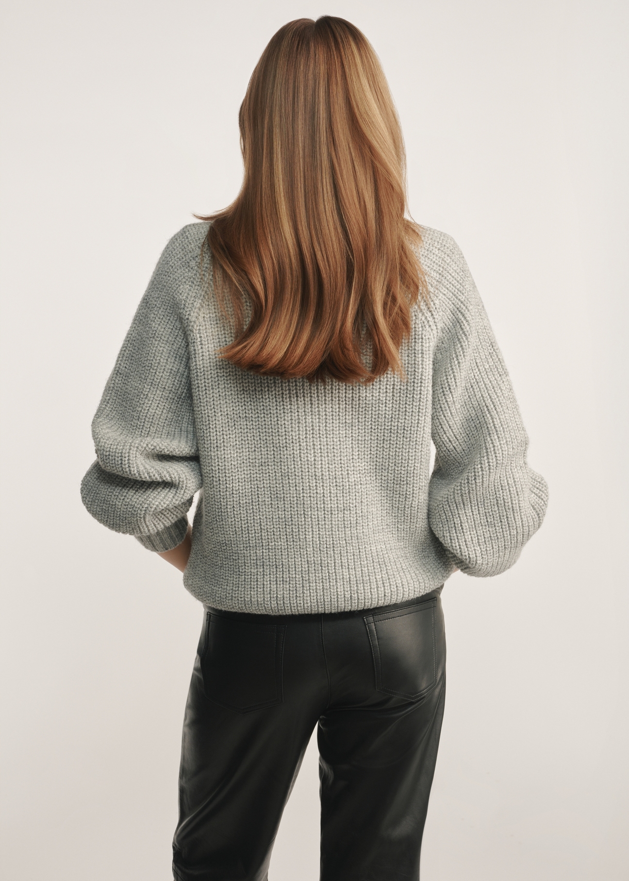 Gray women's oversized cardigan KARDT-0036-66(Z24), product view from the back on the model, half of the silhouette visible.