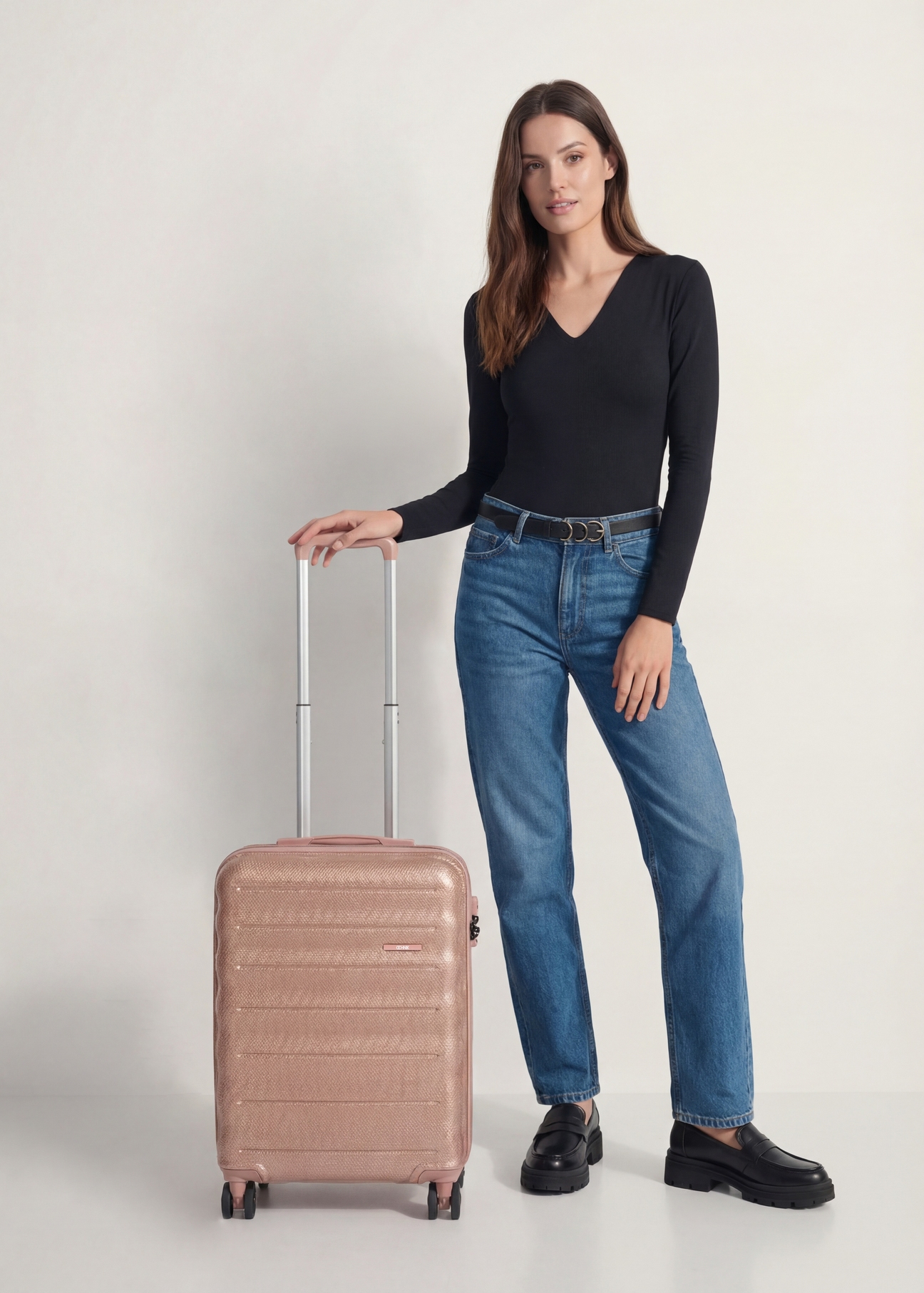 Small suitcase on wheels WALPC-0015-5B-19(W26), front view of the product next to the model's silhouette.