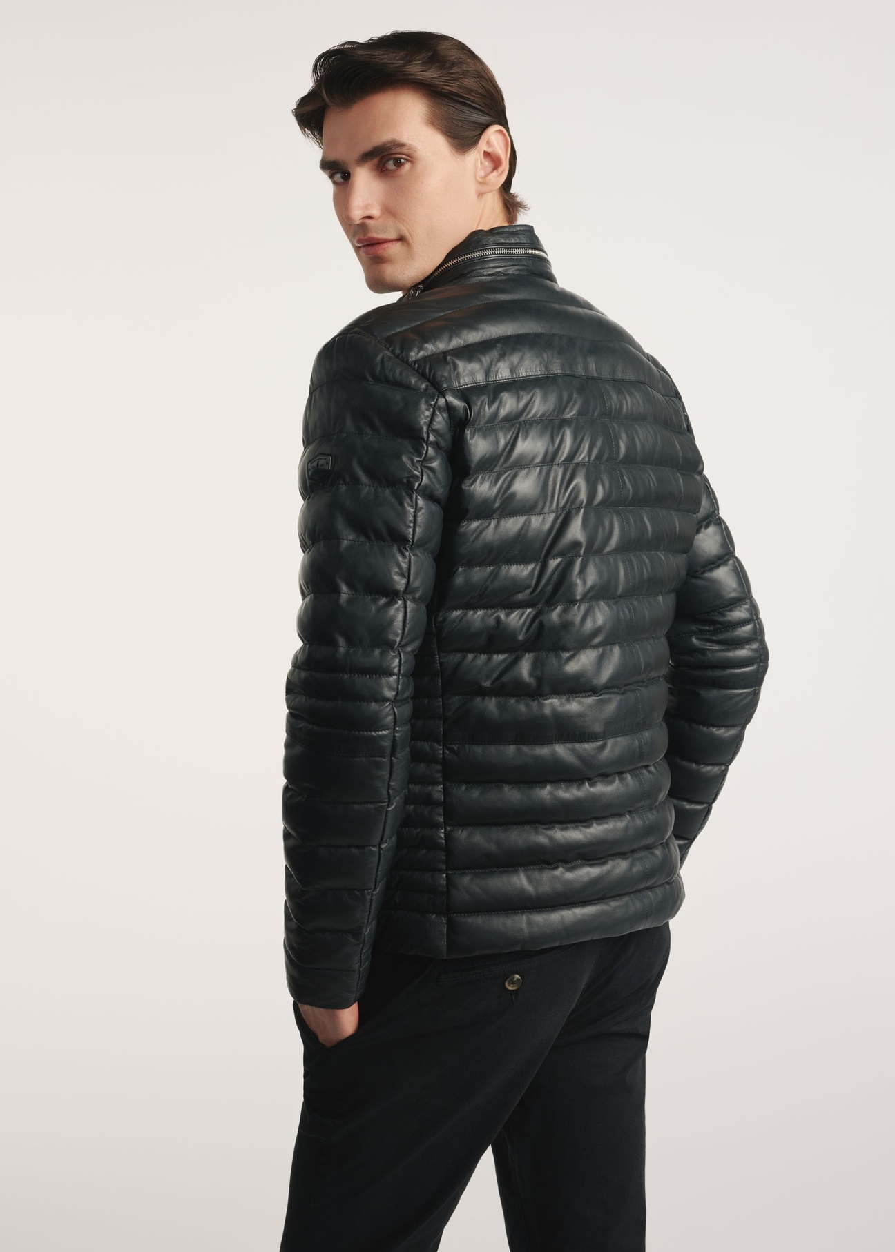 Black men's insulated leather jacket KURMS-0379-3358(Z25), product visible from the back on the model, half of the silhouette visible.
