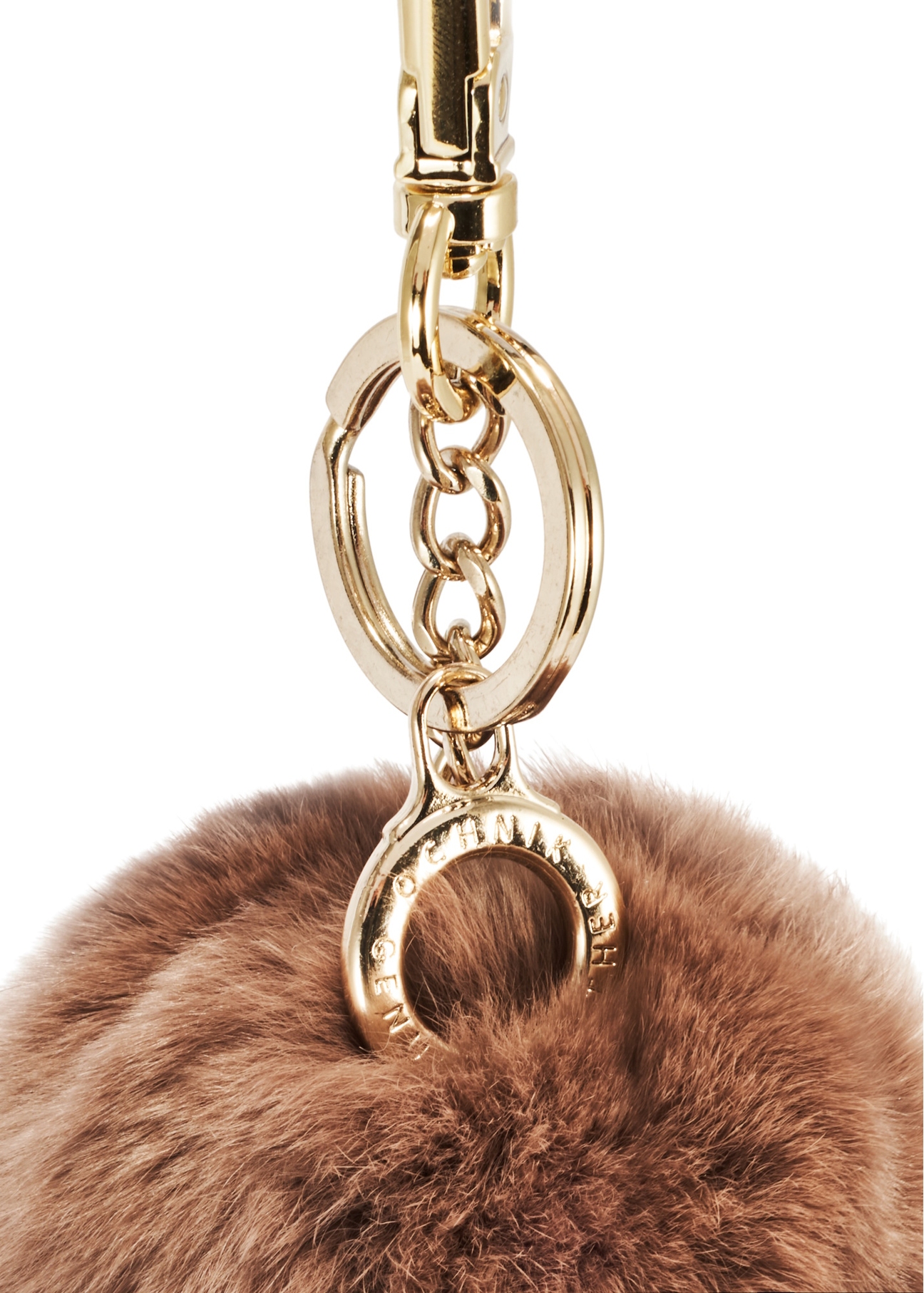 Brown pompom keychain BRELOK-117A-89(Z25), close-up of the product detail on a white background.