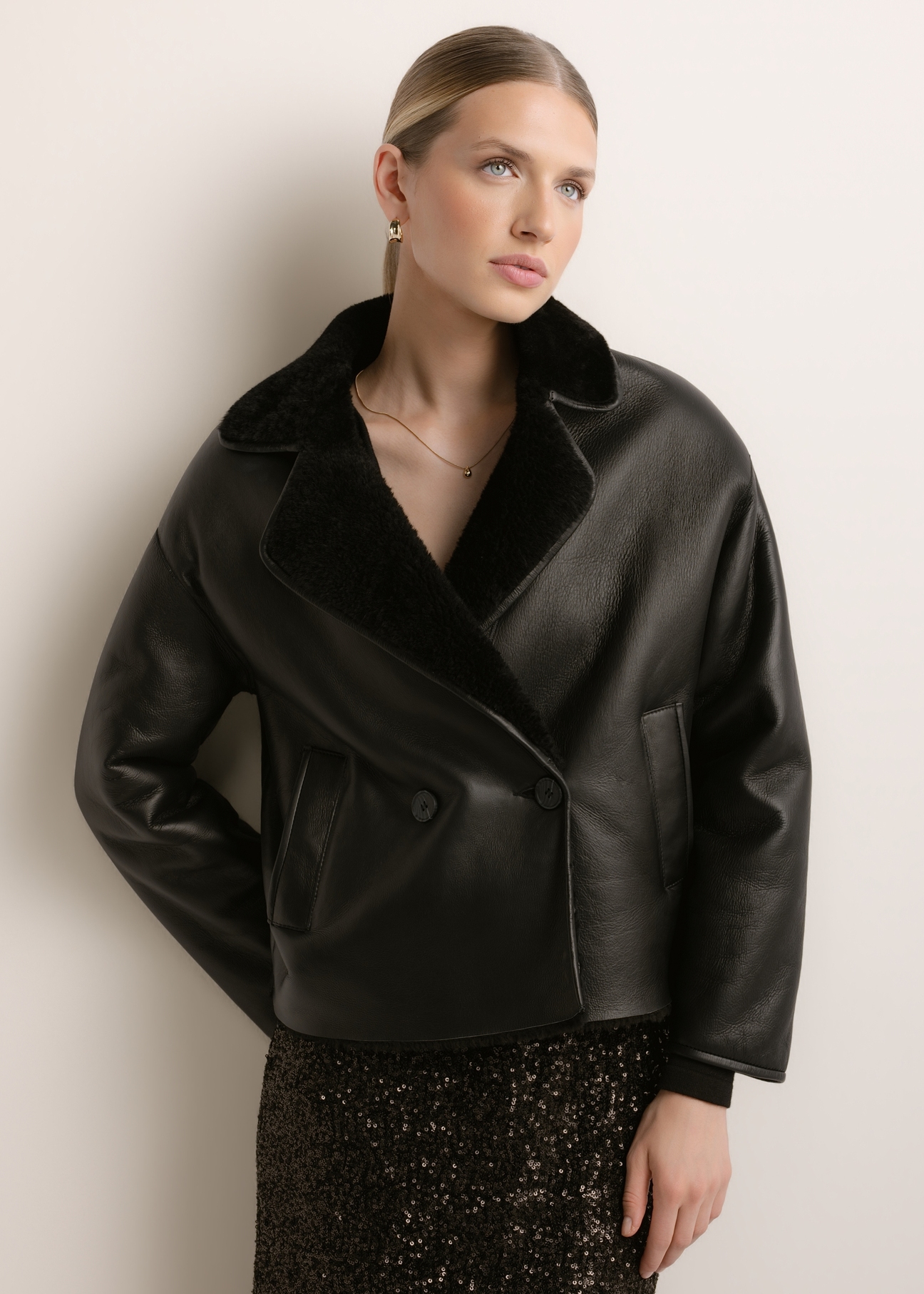 Women's black leather sheepskin coat KOZDS-0105-99(Z26), front view of the product on a model. Half of the silhouette visible.
