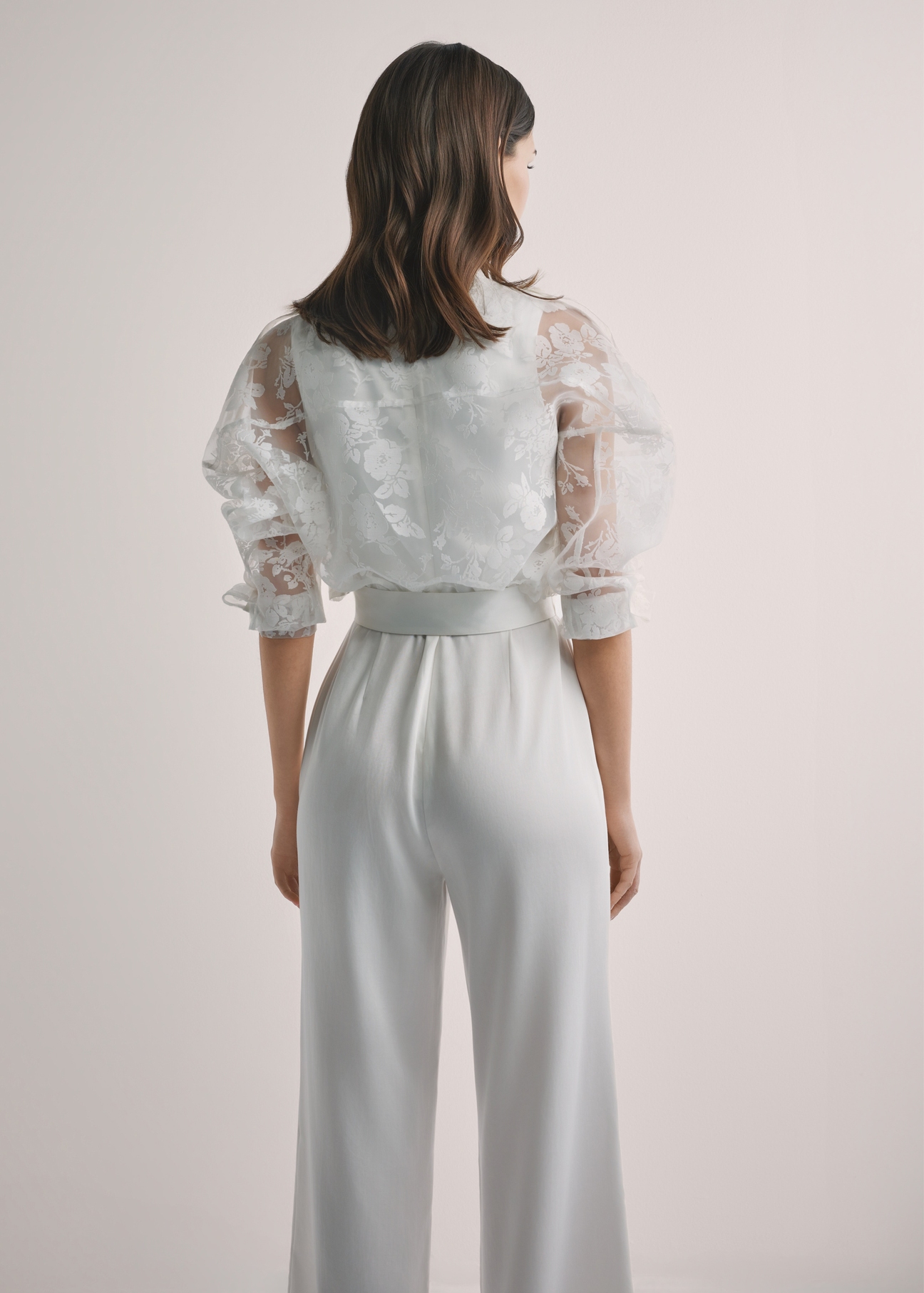 Women's white lace shirt KURDT-0637-0A(W26), back view of the product on the model. Half of the silhouette visible.