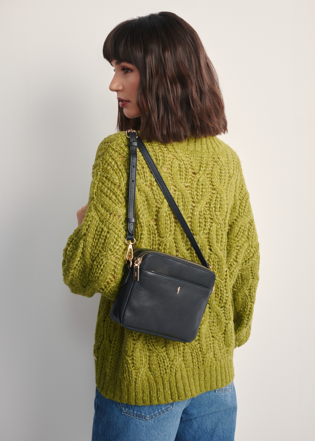 Women's leather shoulder bag TORES-1163-99(Z25), product view on model's shoulder. Half of silhouette visible.