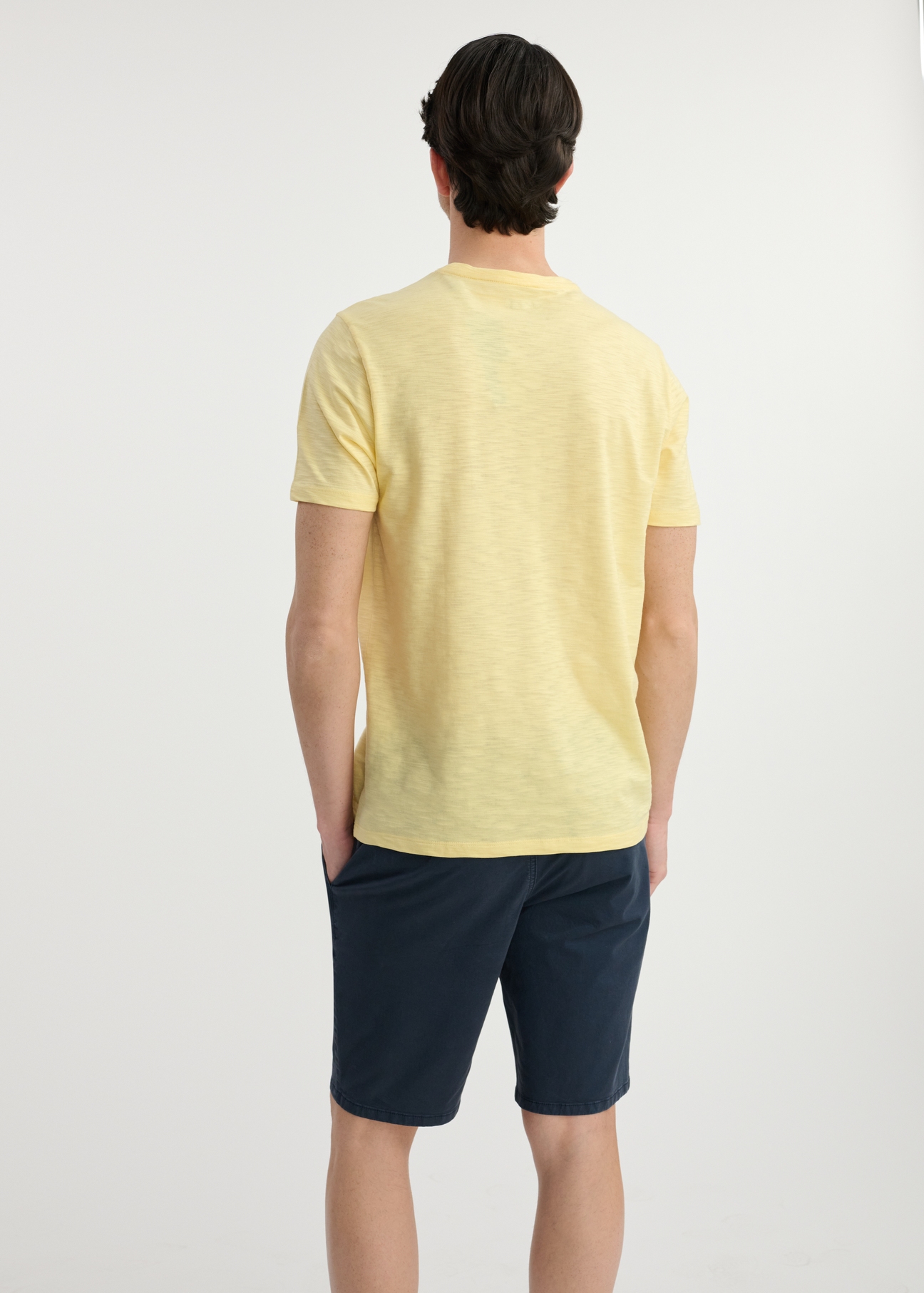Yellow cotton men's t-shirt TSHMT-0121-21(W25), product view from the back on the model. Half of the silhouette visible.