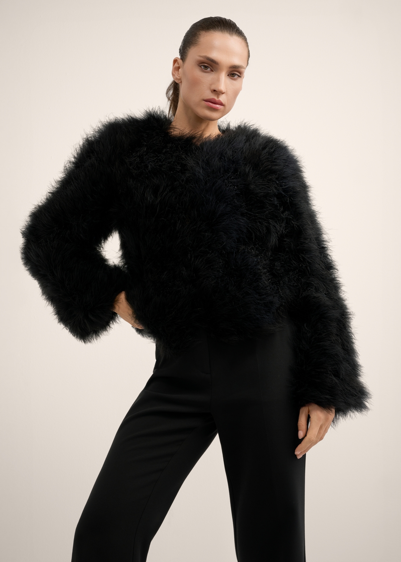 Women's black turkey feather fur coat FUTDF-0097A-99(Z26), front view of the product on the model. Half of the silhouette visible.