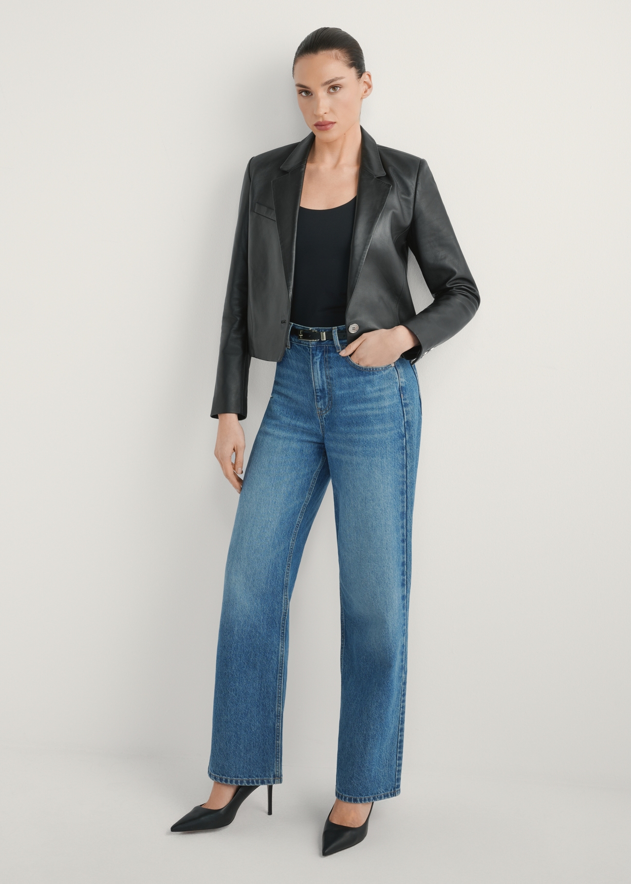 Women's short leather jacket KURDT-0522-99(W26) - front view of the product, on a model, against a light background. Full body visible.